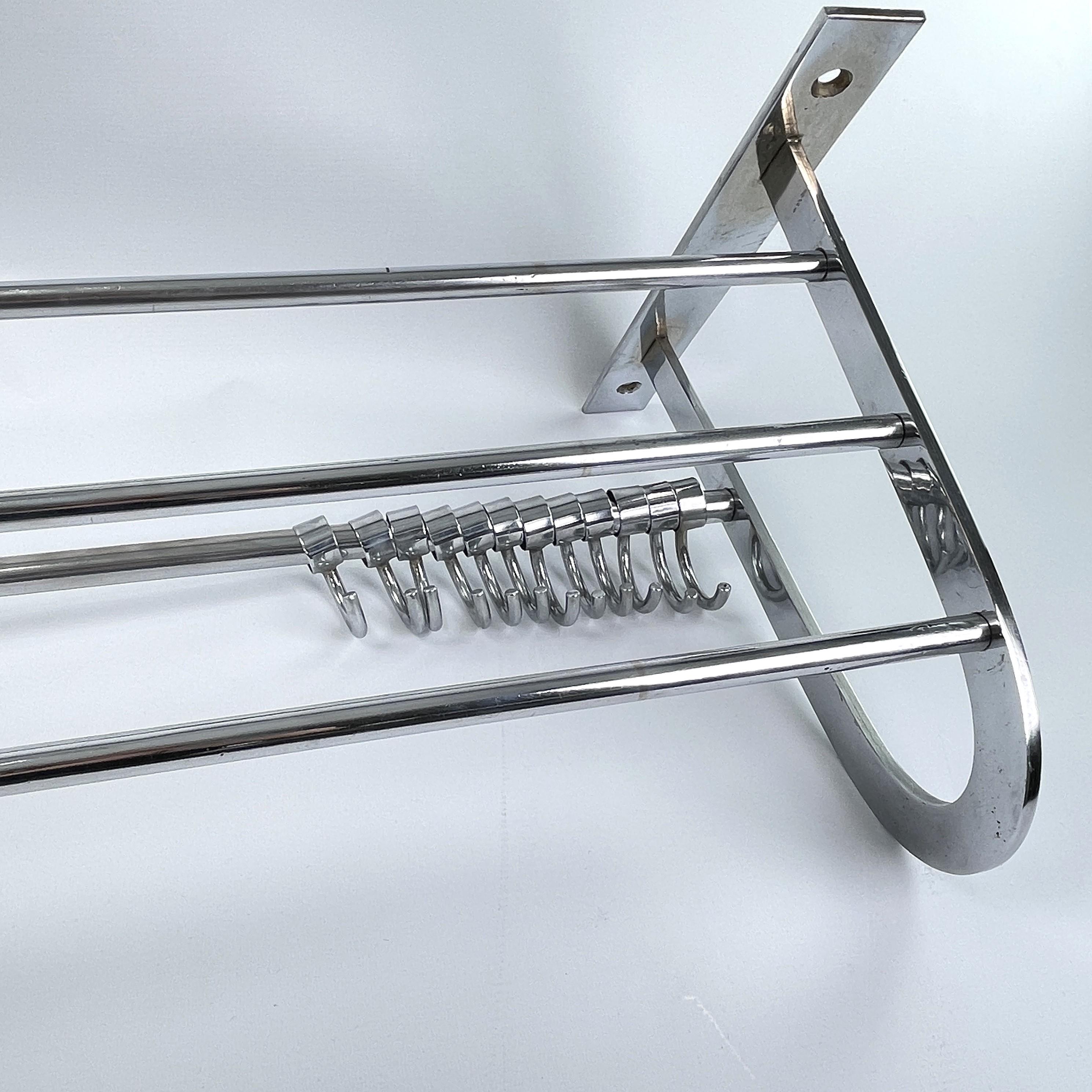 Bauhaus wardrobe chrome - 1930s

This beautiful wall coat rack is from the 1930s. This is a beautiful, timeless and antique piece that will leave a lasting impression.
Fits well in almost any style of interior.

This cleaned coat rack has 12 movable