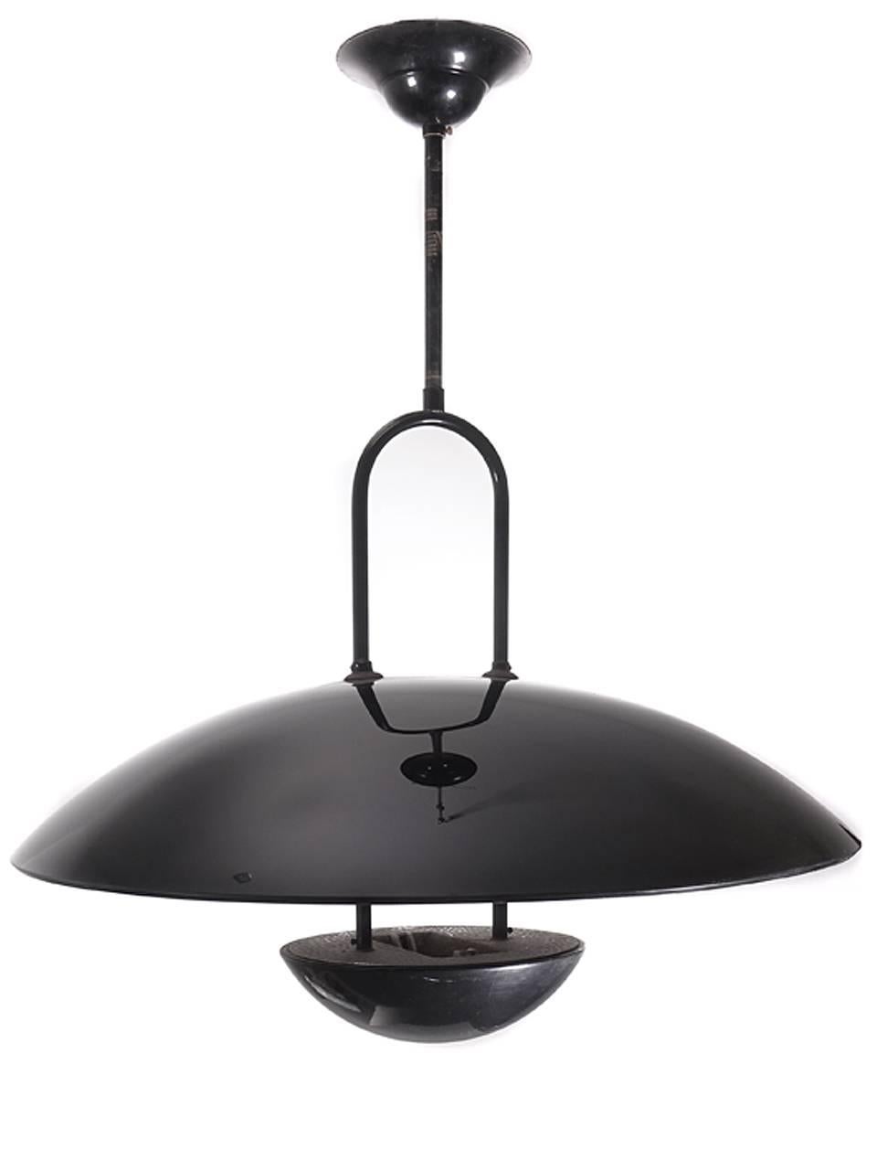 The 24 inch top dome is heavy opaque black glass. The inside is mat ground glass with a deeply grooved pattern. The dome top is gloss. Everything else is has a black paint finish. The look is very clean and architectural. It takes one halogen bulb.