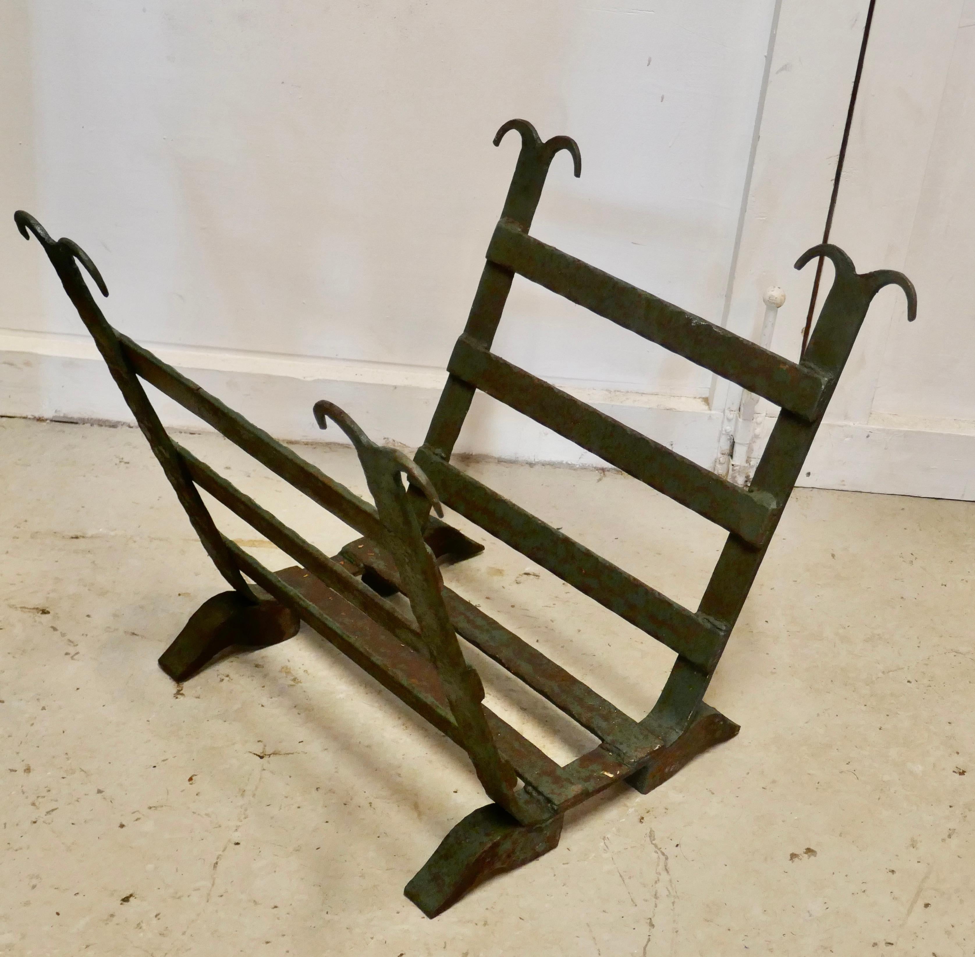 Heavy Blacksmith Made Inglenook Iron Log Carrier  

This is a sturdy and heavy piece made to hold logs, it has been made in a U shape holder for Fireside Logs  
Made from iron bars, and at some time in the past has been painted green, this is now