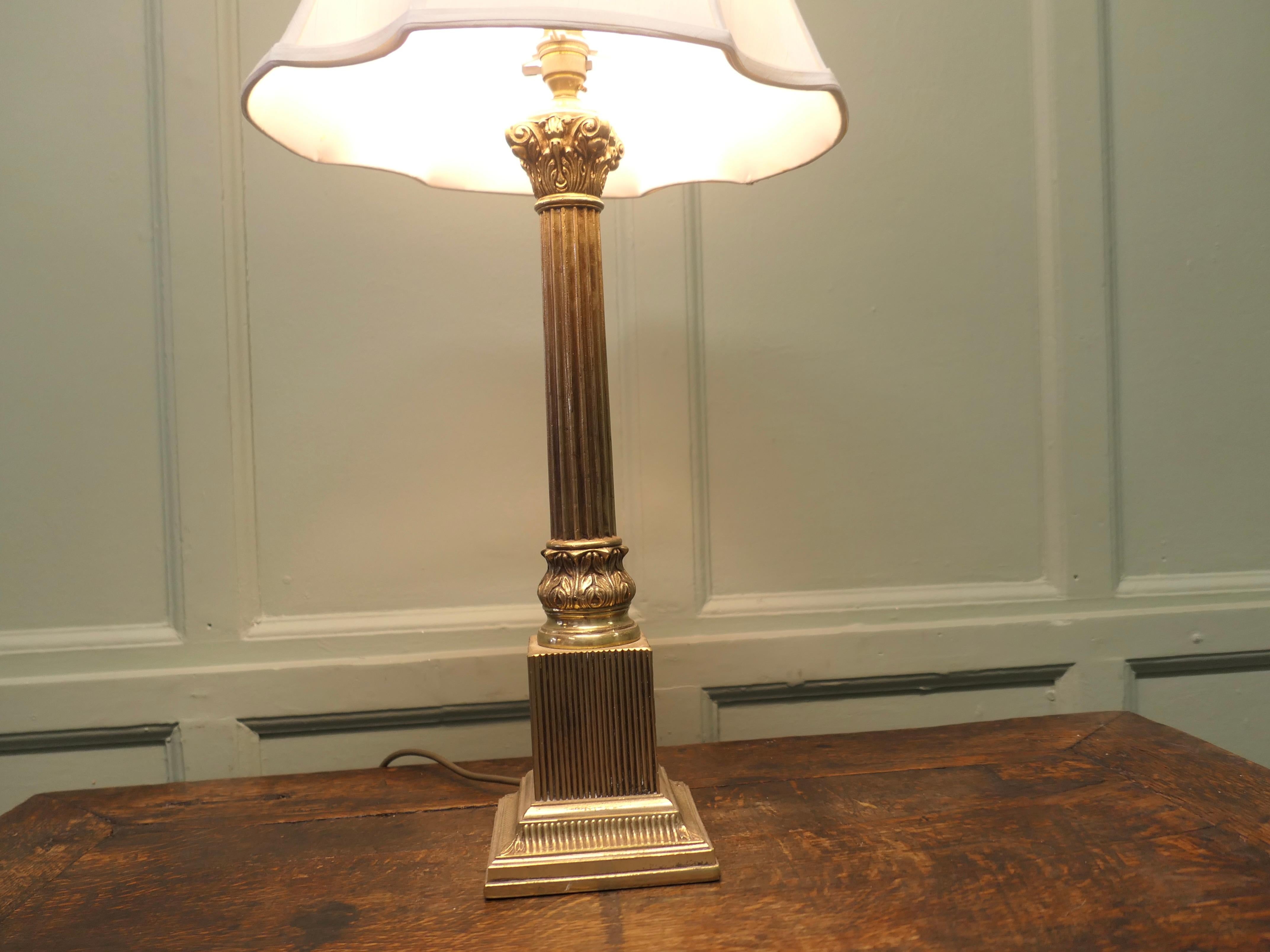 Mid-20th Century Heavy Brass Corinthian Column Table Lamp  This is a very attractive piece For Sale