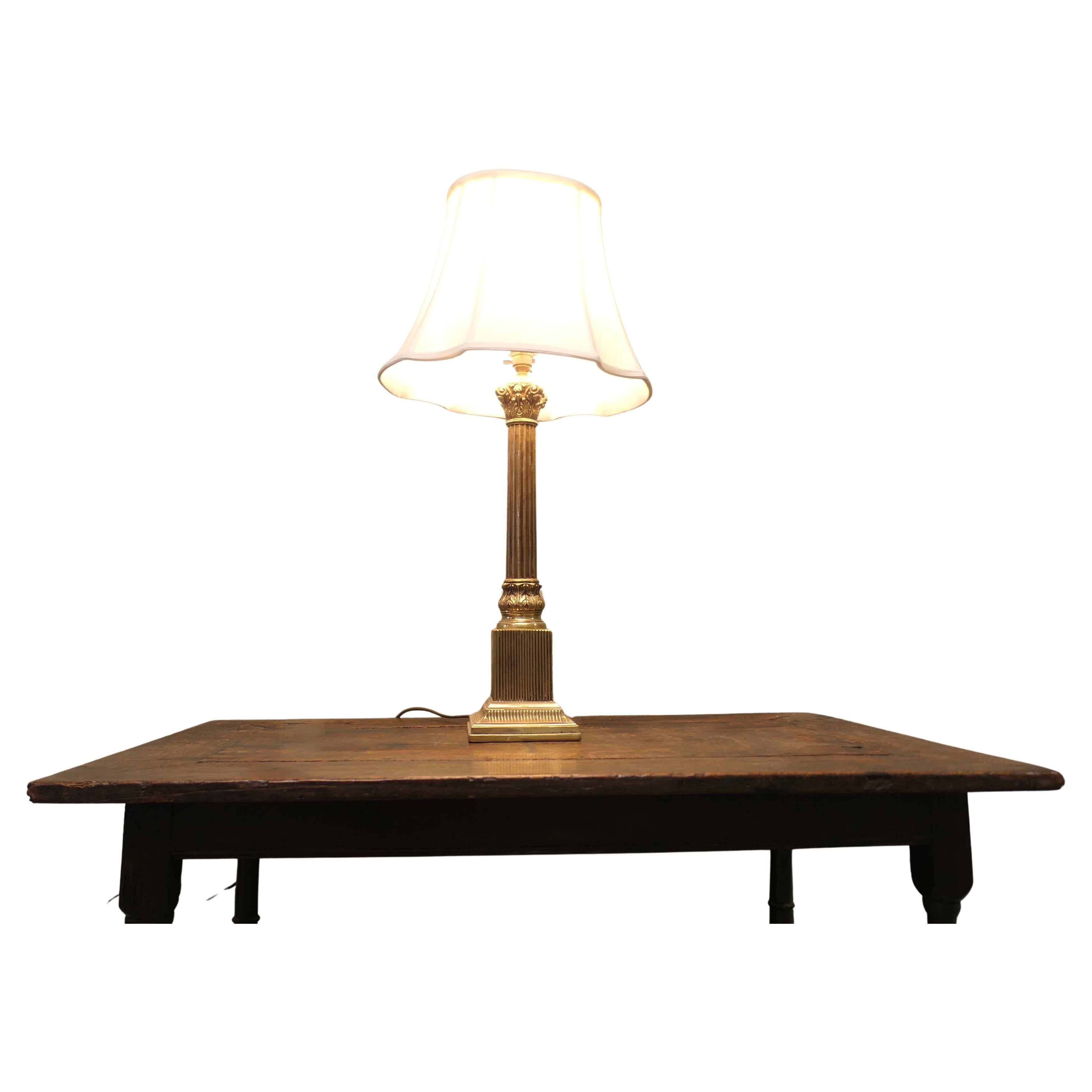 Heavy Brass Corinthian Column Table Lamp  This is a very attractive piece For Sale