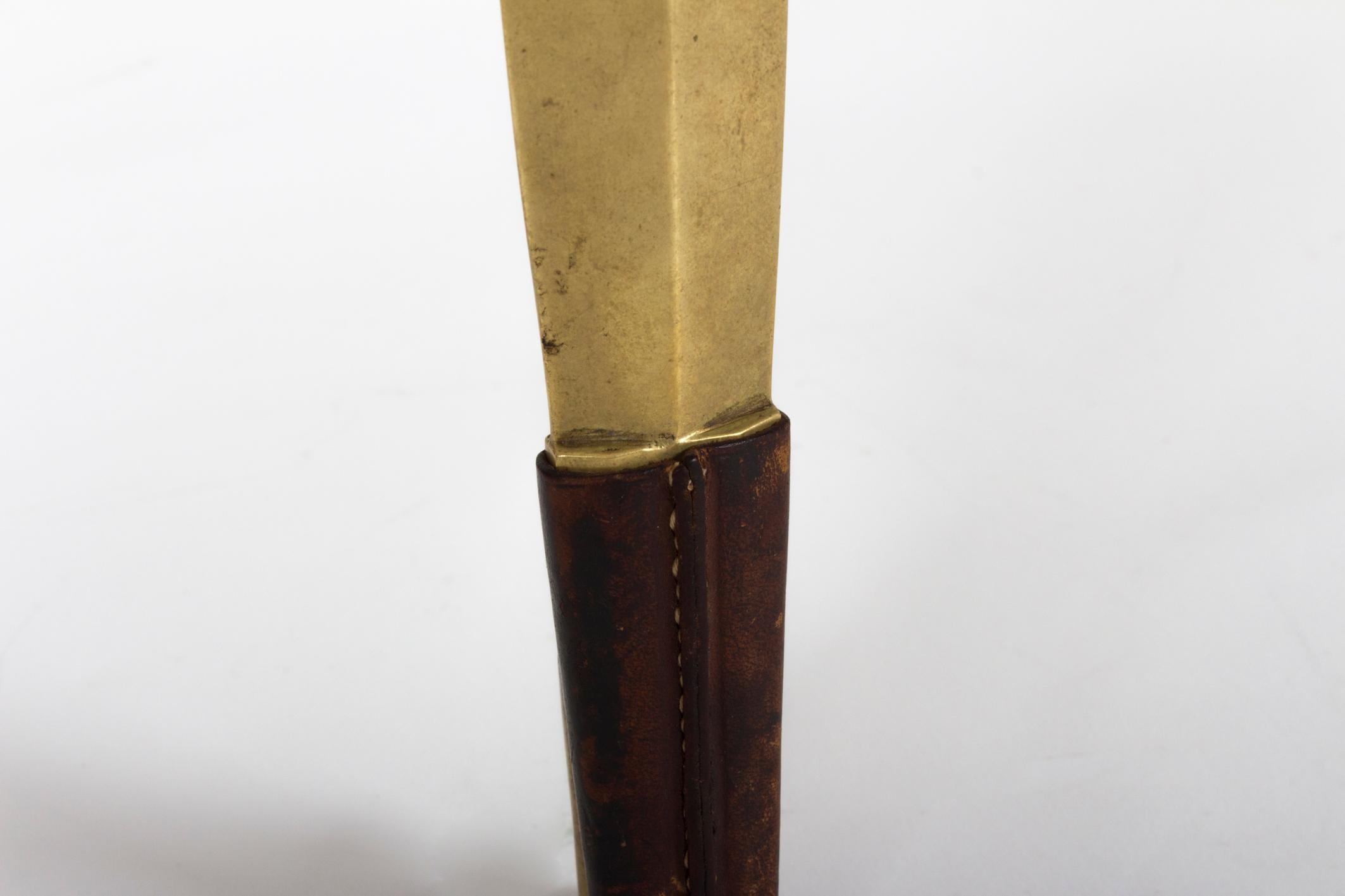 This rather beautiful desk accessory was made by the well known Auböck workshop during one of their most innovative and creative periods, midcentury, Vienna.

Shaped almost exactly like a tribal Assegai Spearhead widely used in Africa by e.g. Zulu