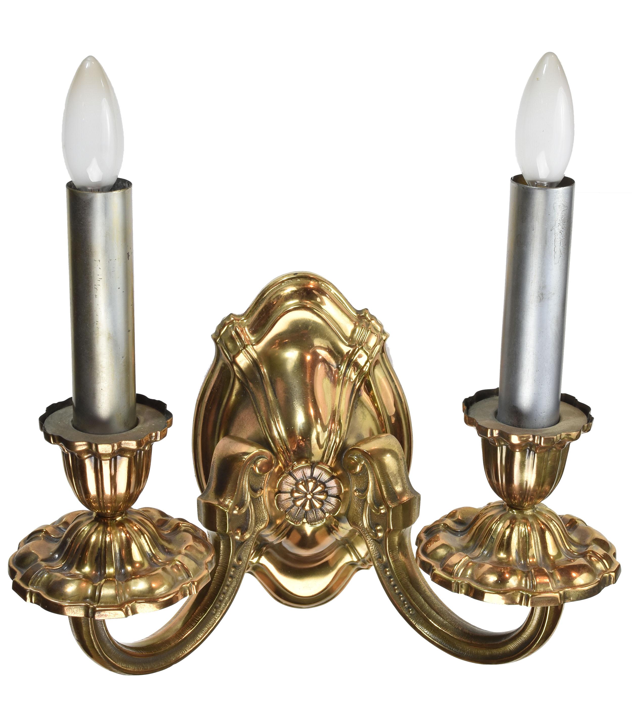 Lovely cast brass sconces. The curves and shine on this sconce keep your eye constantly moving while you’re able to rest your eye on the centre flower. This sconce is beautifully symmetrical and you’re able to appreciate it fully at eye height when