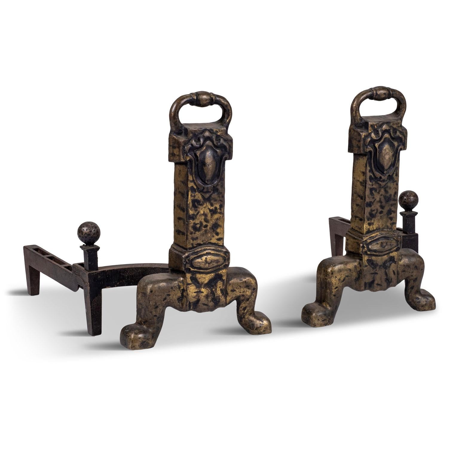 Heavy bronze antique andirons cast by the Adams Company circa 1930s in the USA. Solid and expertly made with cast iron rear portions. Sold together and priced $1,800 for the pair.