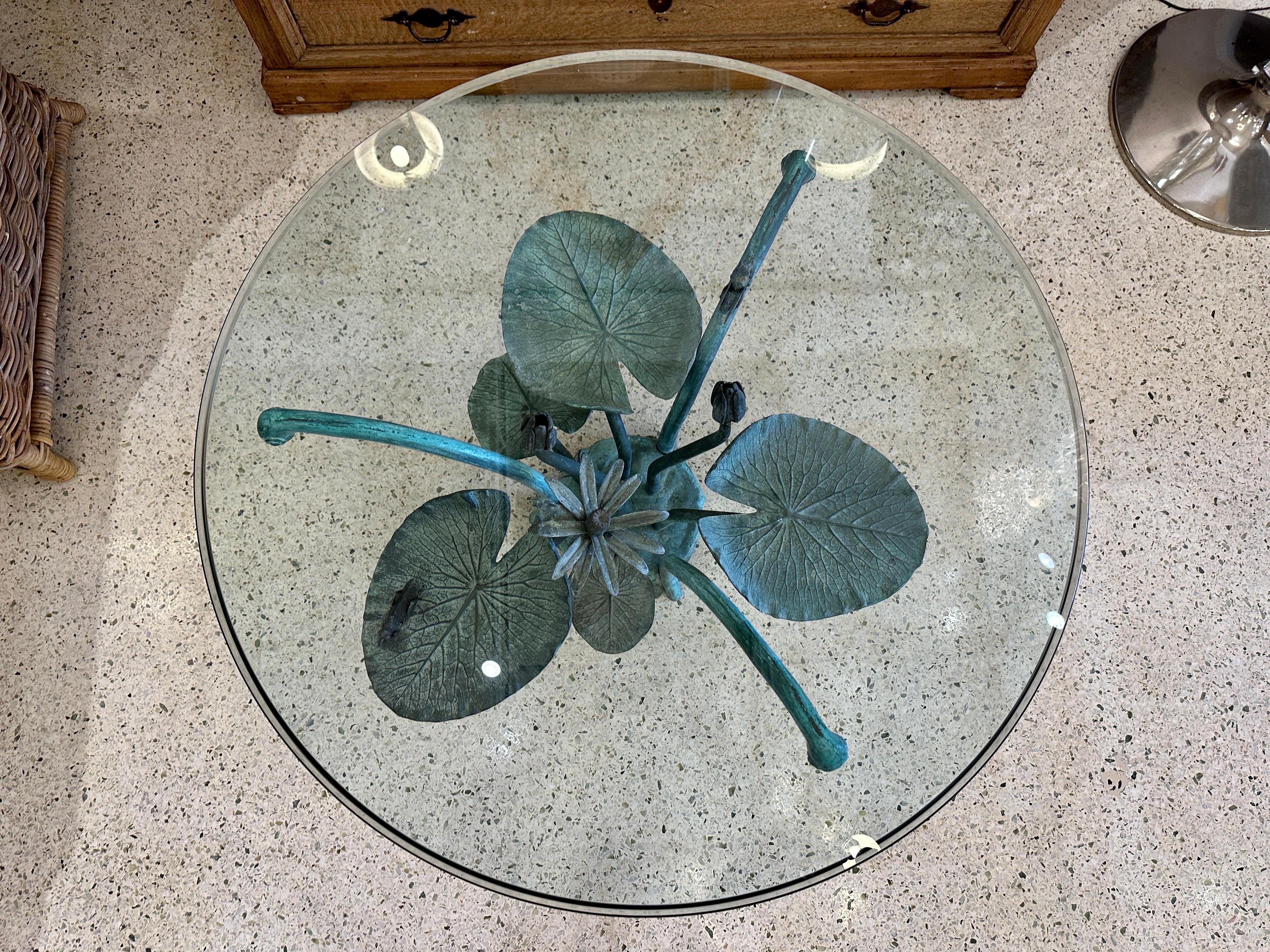 This wonderfully whimsical bronze coffee table with 36 inch diameter beveled glass top features large bronze lily pads, flowers and grasshoppers in the MOST beautiful verdigris patina finish. ALL original - Glass is very clean and without chips or