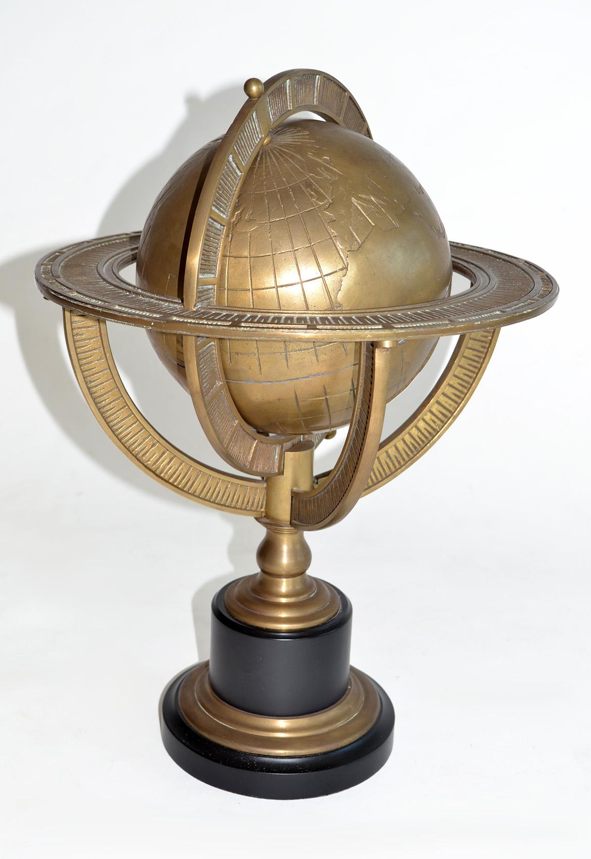 Heavy Bronze terrestrial Globe on Black Base, 1990's
Heavy bronze terrestrial globe with armillary rings mounted on a sleek black metal base. This substantial decorative globe features detailed relief mapping on a rotating solid bronze sphere,