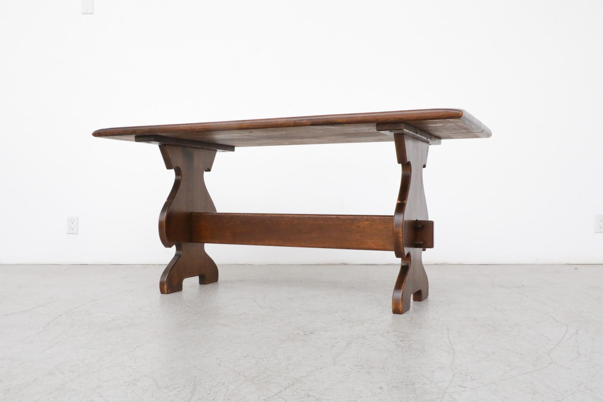 Heavy Brutalist Solid Dark Oak Trestle Table with Ornate Base In Good Condition For Sale In Los Angeles, CA