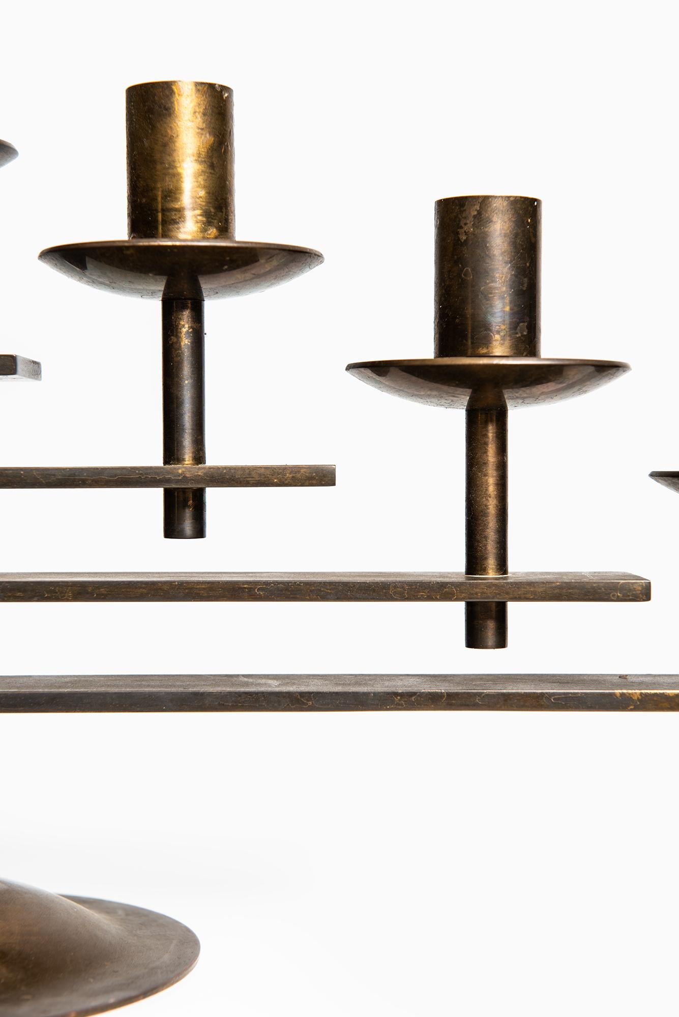 Rare and heavy candlestick in brass produced in Denmark.