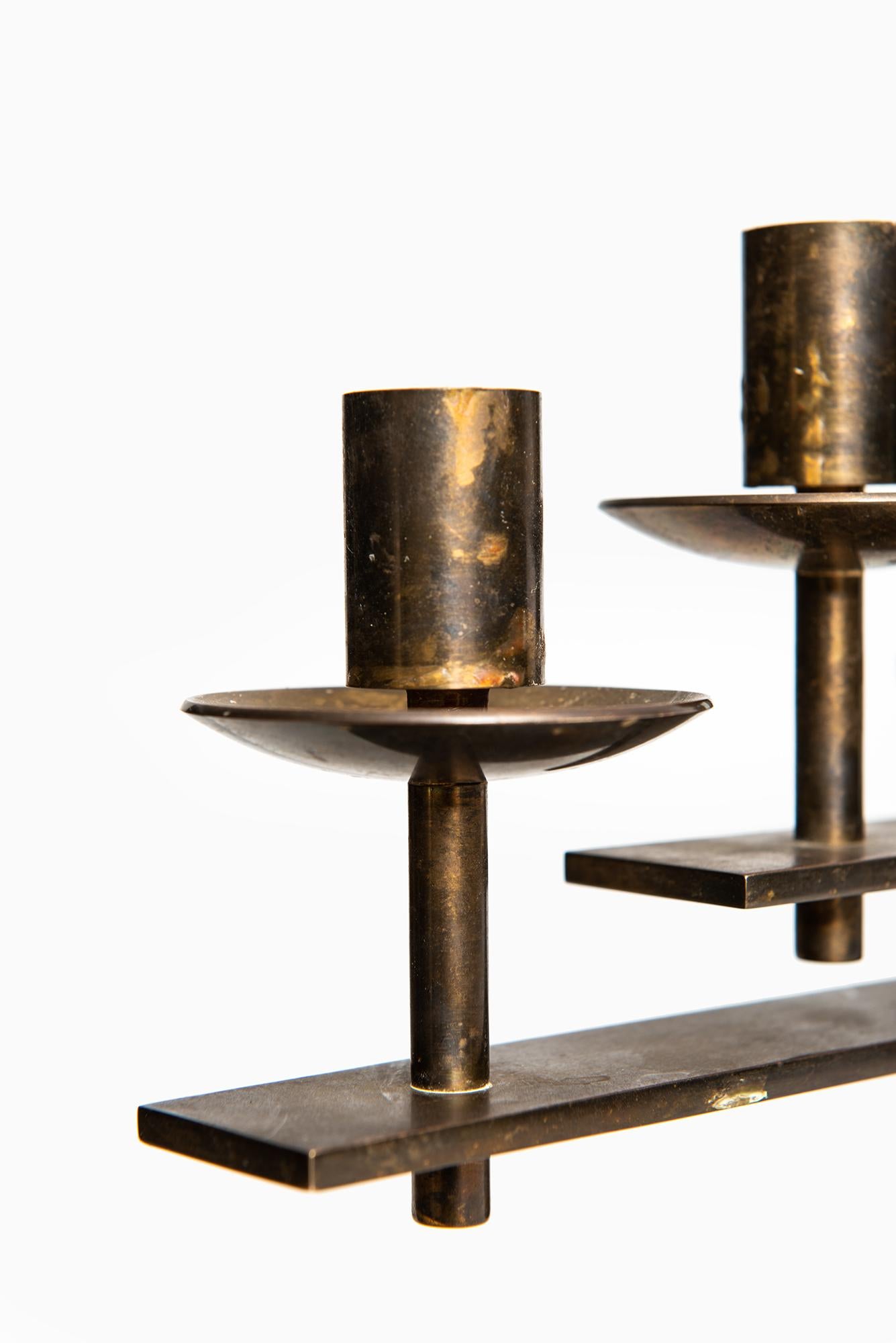 Mid-20th Century Heavy candlestick in brass produced in Denmark For Sale