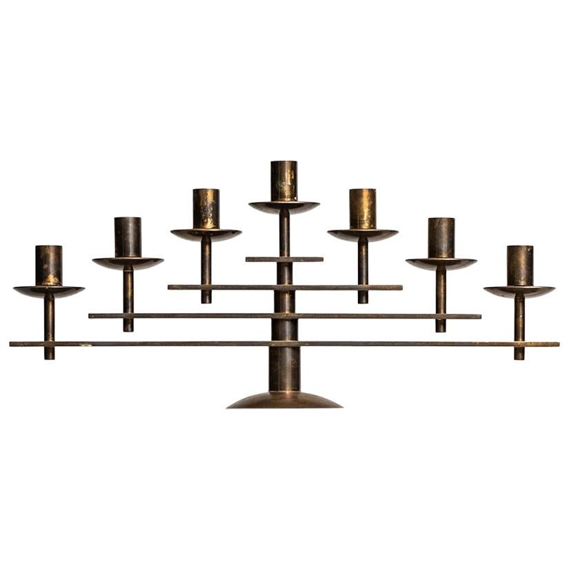 Heavy candlestick in brass produced in Denmark For Sale