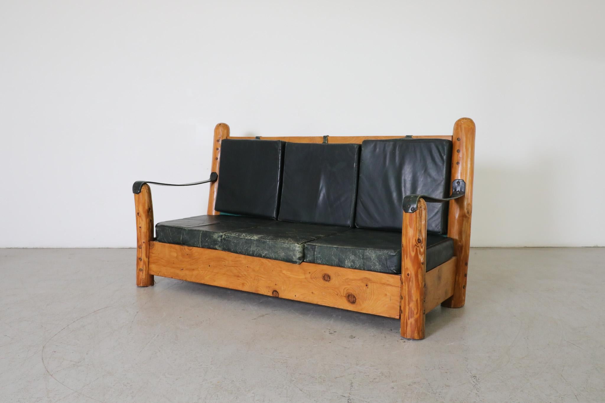 Mid-Century Modern Heavy Carved Pine and Green Leather Loveseat with Sling Arms & High Slatted Back For Sale