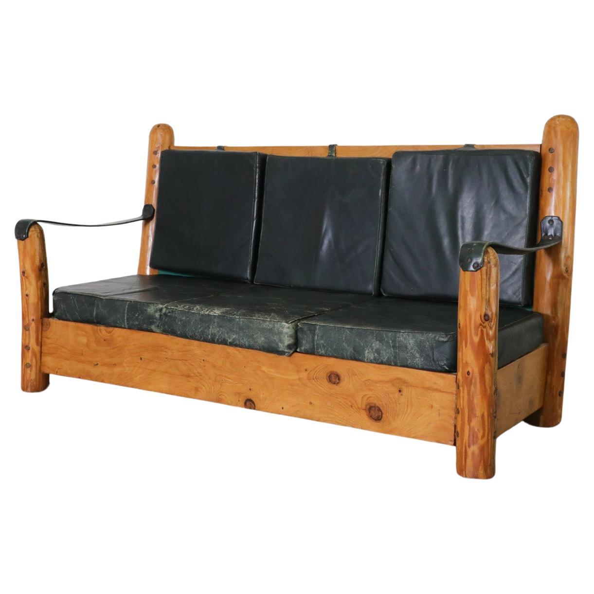Heavy Carved Pine and Green Leather Loveseat with Sling Arms & High Slatted Back For Sale