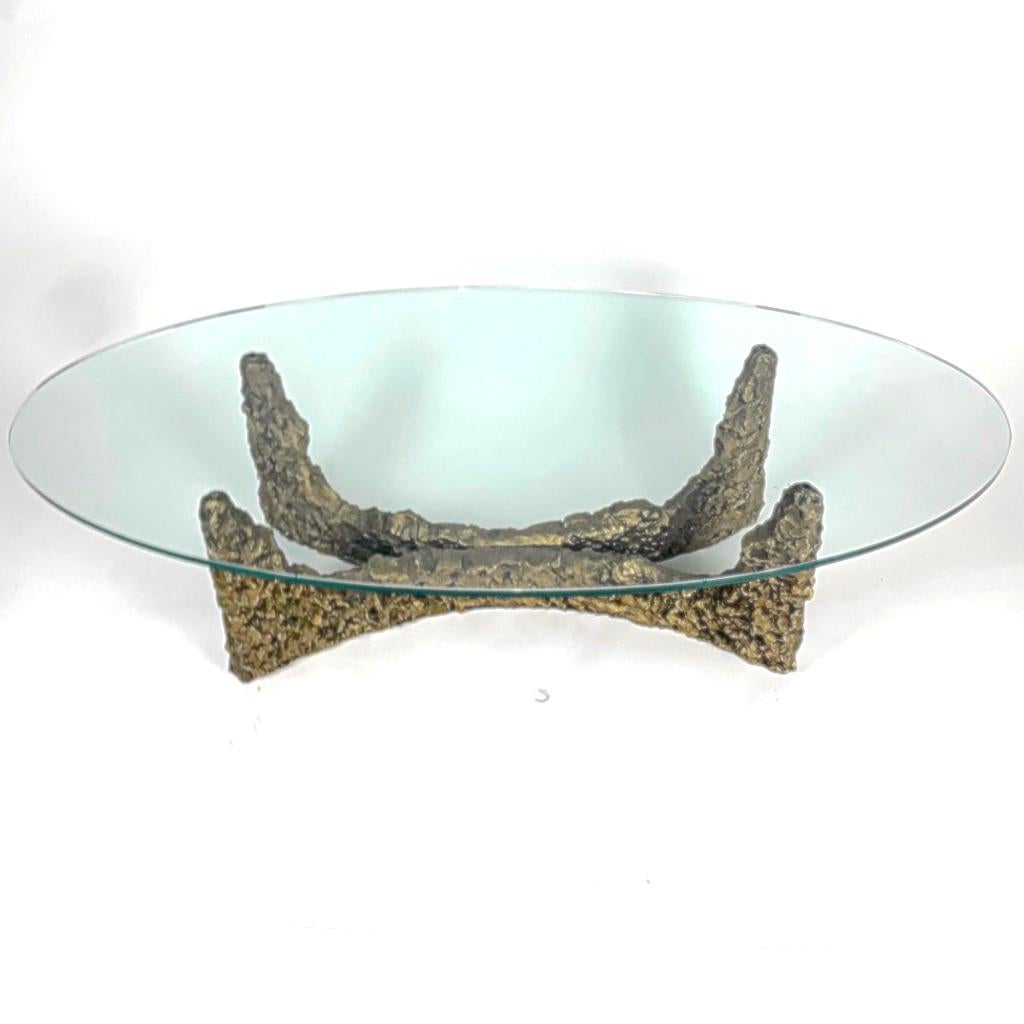 Heavy bronze or gold colored cast metal Brutalist stalagmite coffee table in the manner of Paul Evans. This is a very heavy sculptural table bass with a thick oval glass top.
Base alone measures: 33