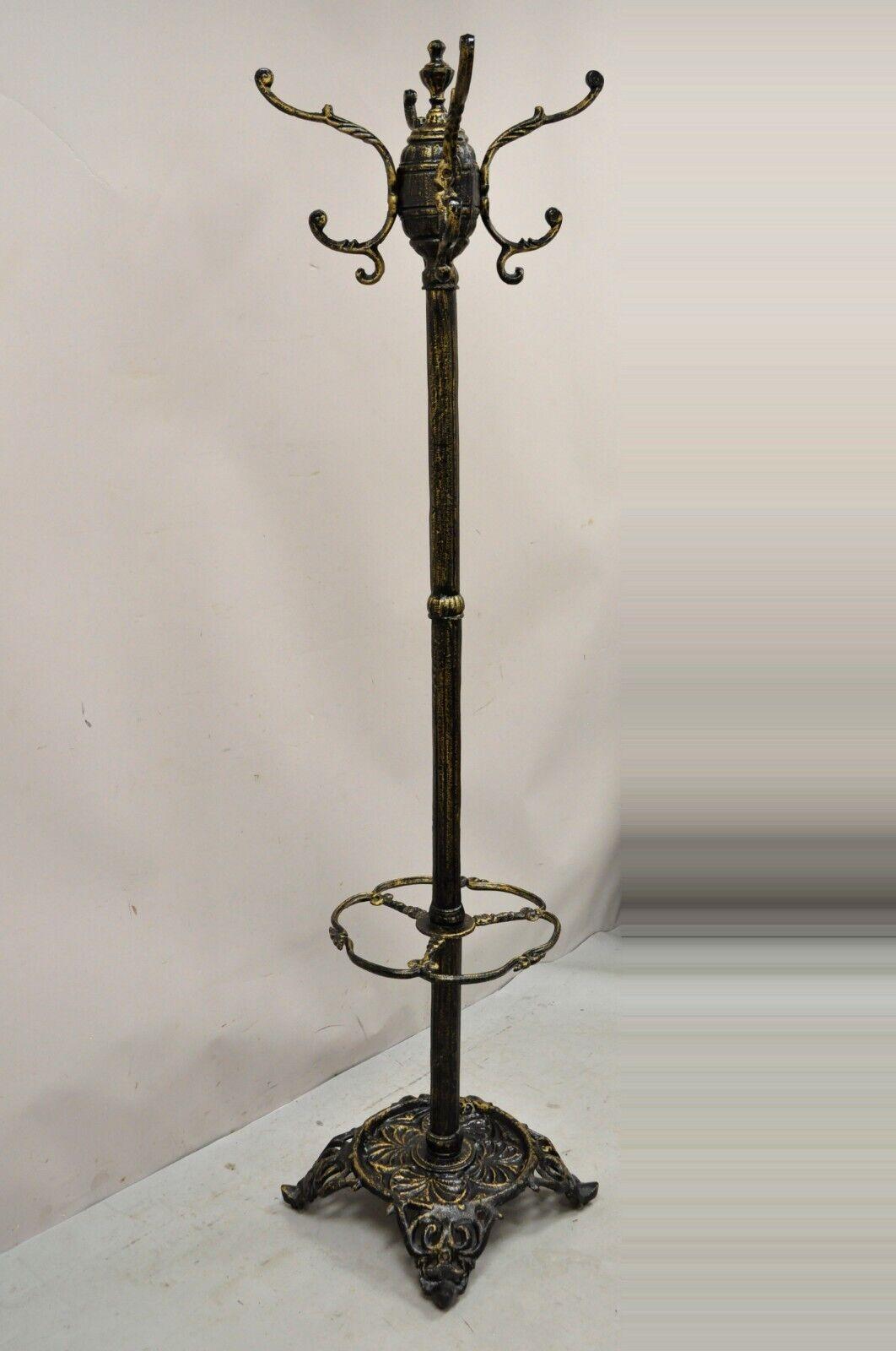 Heavy Cast Iron Victorian Style black coat tree umbrella hall stand. Item features a heavy cast iron frame, 4 double hooks (8 hooks total), distressed finish, approx. 70 lbs. Circa Late 20th Century - Early 21st Century. Measurements: 76