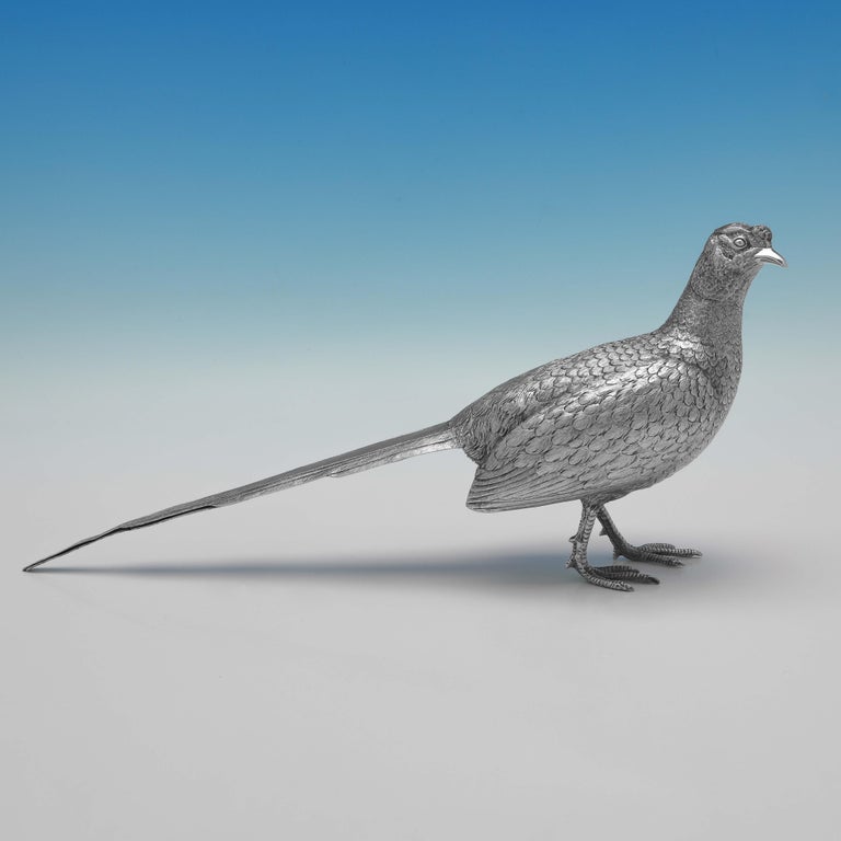 Hallmarked in London in 1967 by Richard Comyns, this handsome, pair of Sterling Silver Pheasants, are realistically cast and hand finished. 

The male measures 6.25