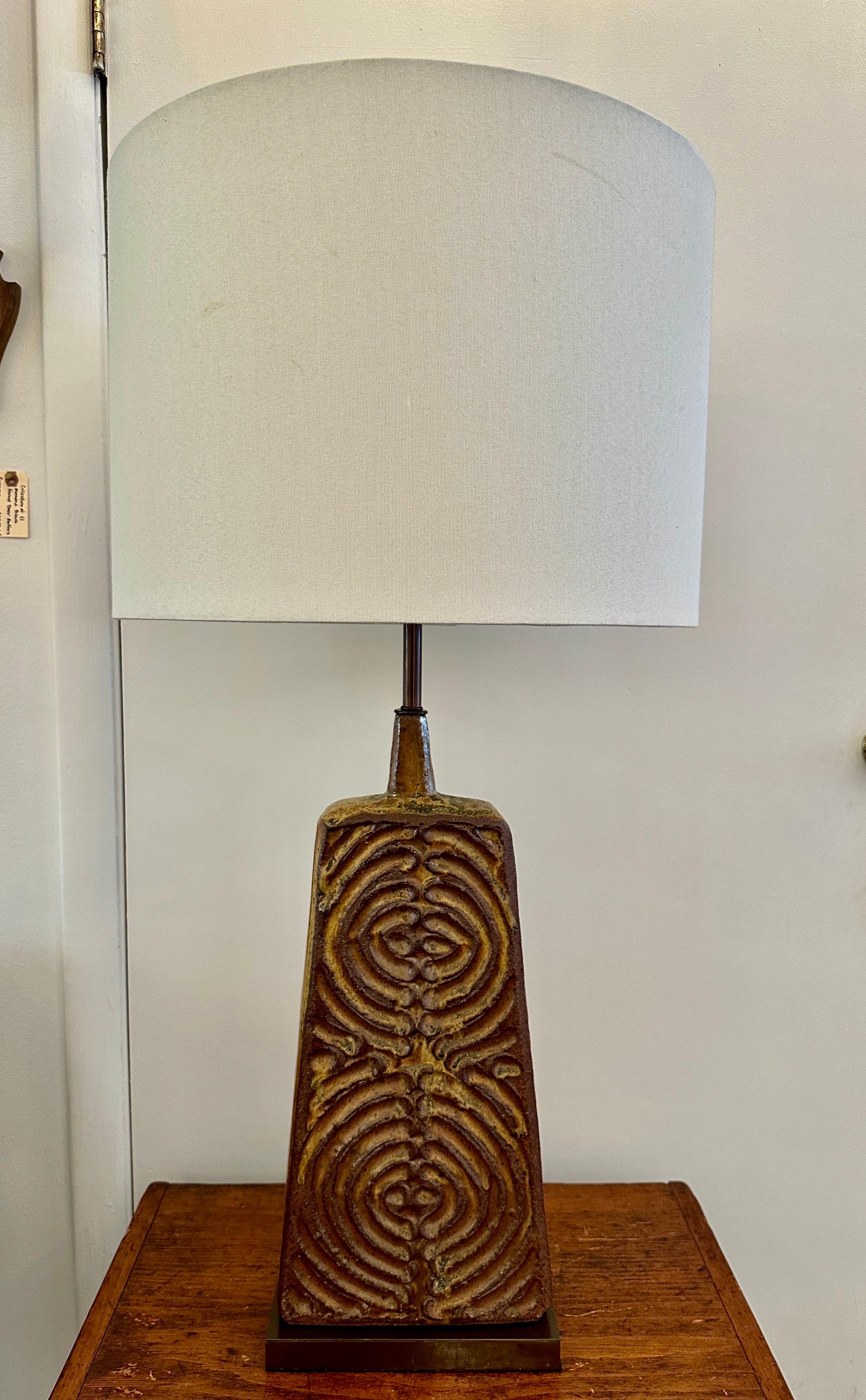 One of our favorite lamps, VERY heavy and important, the thick ceramic trapezoidal base with circular designs front and back.  This has been NEWLY rewired with silk cable, double cluster sockets that fit Edison bulbs up to 100 watts.