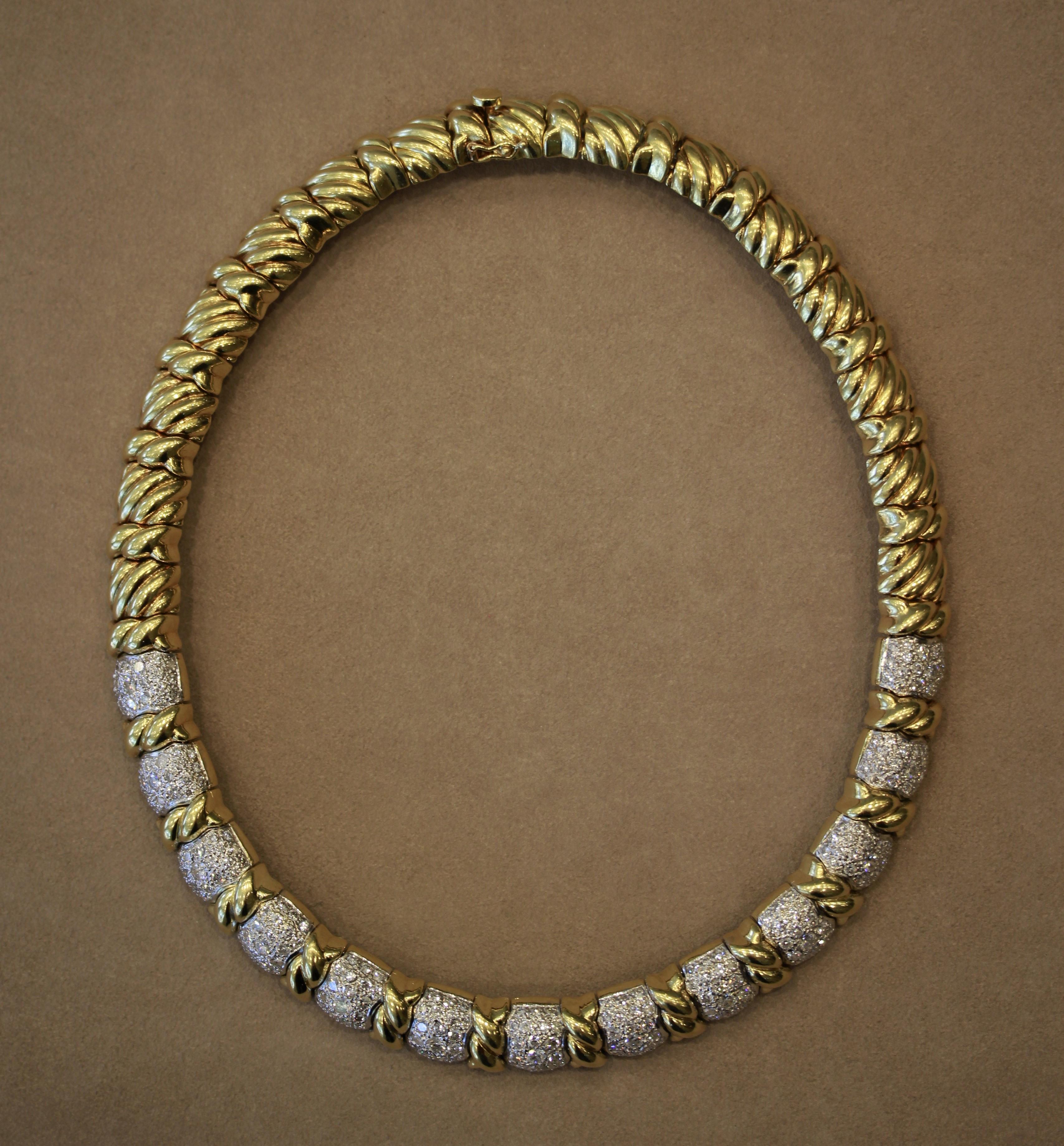 A statement piece, this necklace made in 18k yellow gold features 12.20 carats or round brilliant cut diamonds. Each link has some movement from each other allowing the necklace to lay flat on the neckline with comfort. The necklace weighs a total