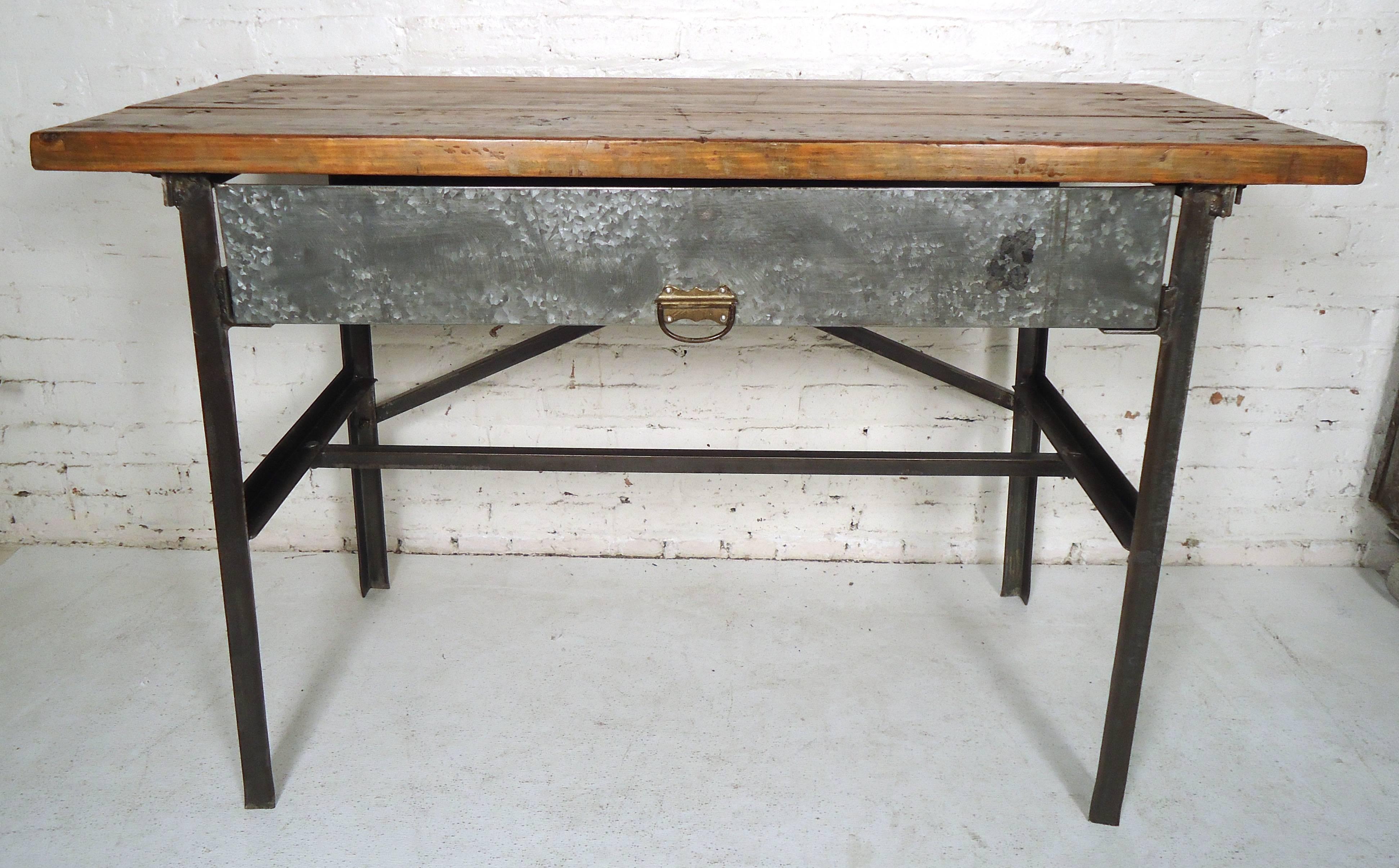 Butcher block top factory table with metal base. Metal has been stripped to bare metal and lacquered for a handsome industrial look, which can take this vintage workshop table into your modern home.

(Please confirm item location, NY or NJ, with