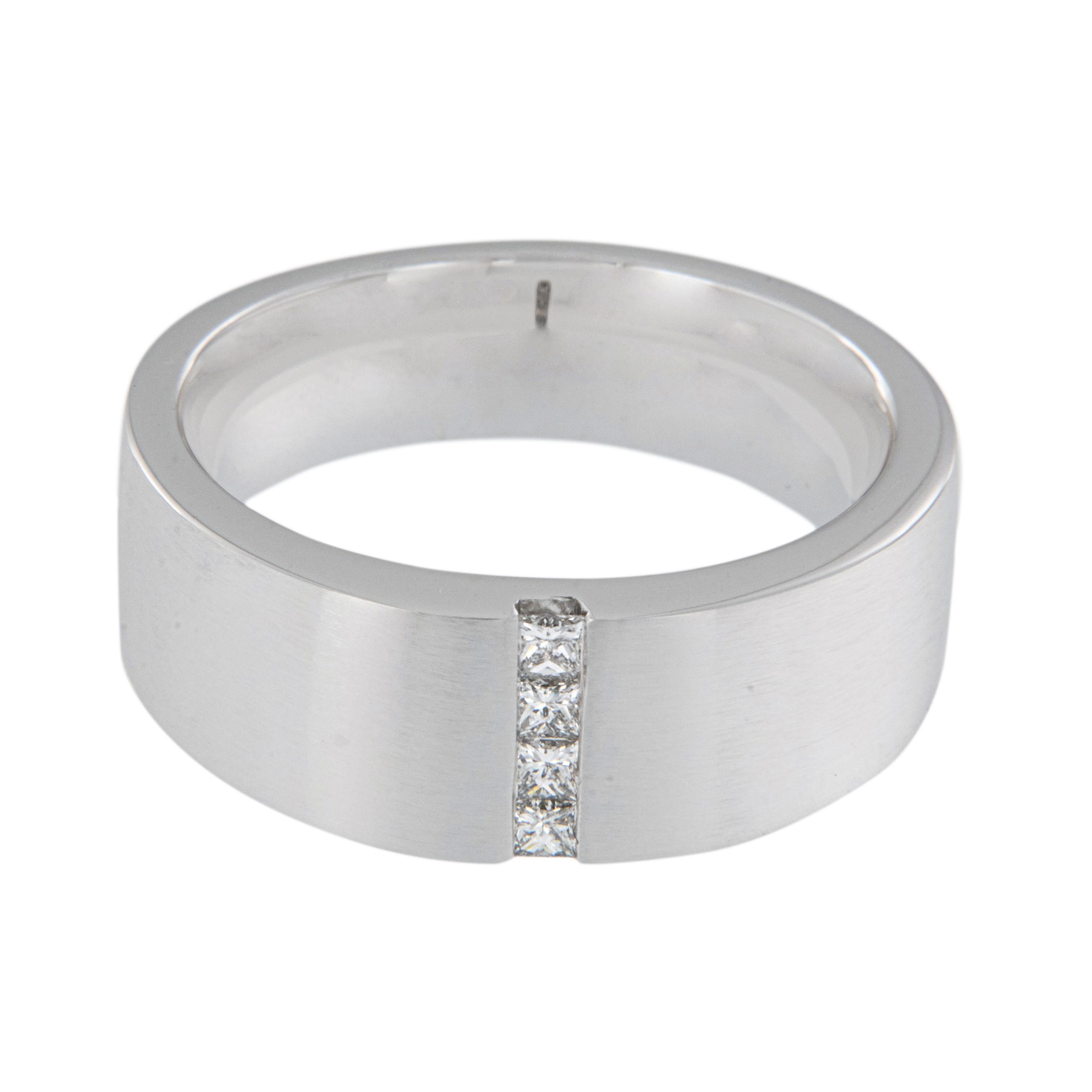 Everybody loves a sharp dressed man! And you will definitely be sharp dressed wearing this 14 karat white gold band accented with 4 princess cuts = 0.24 Cttw in a size 9.5 but can be sized. Handsome brushed finish for a subtle look with a comfort