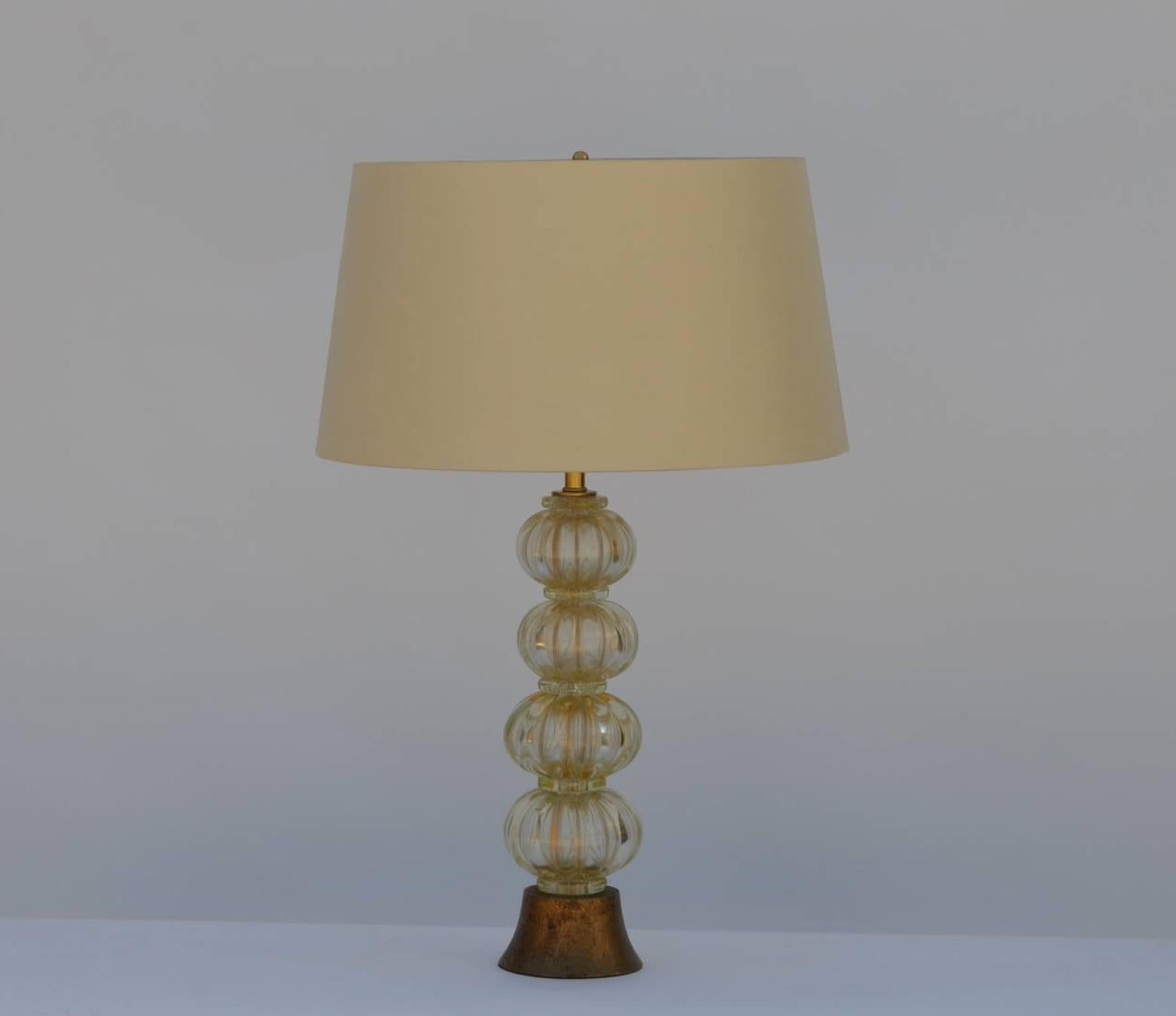 Heavy Gilt Murano glass stem lamp with custom silk shade in the style of Barovier. Gilt wood base. Restored and rewired with gold twist cord.

Custom shade dimensions: upper edge 16 inches, lower edge 19 inches, height 10.5 inches. Overall lamp