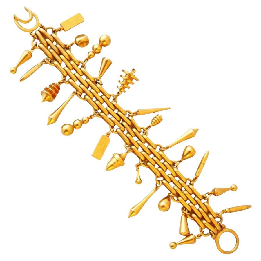 Bracciale a catena in oro pesante con charms di Leslie Block, anni '80