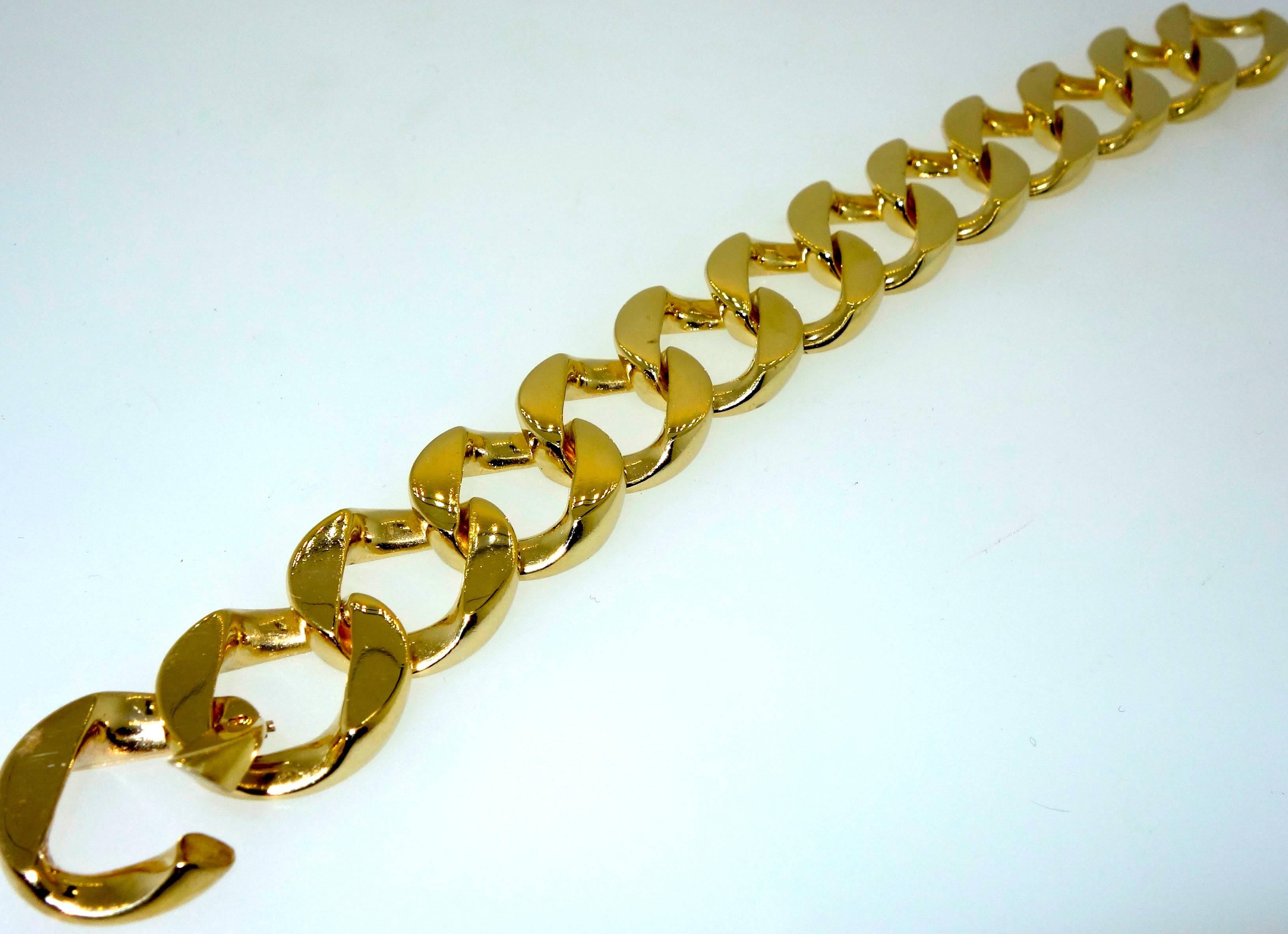 Classic curb link just over seven inches in length and weighing 68.3 grams.  This substantial bracelet is easy to wear and lays flat on the wrist.  Circa 1960