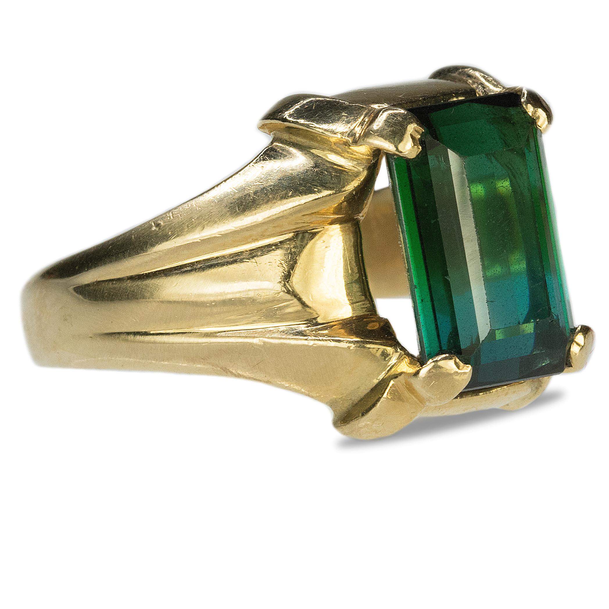 14k Yellow gold ring with approximate 8.00 carat vivid blue green Tourmaline.  18.23g