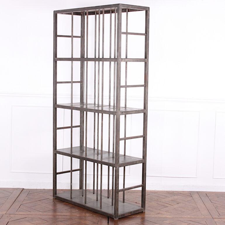 A heavy-gauge welded steel open shelving unit having three shelves of equal spacing, the open sides of 'ladder' design, the shelves reinforced and divided by vertical welded uprights. A very sturdy and functional piece capable of supporting