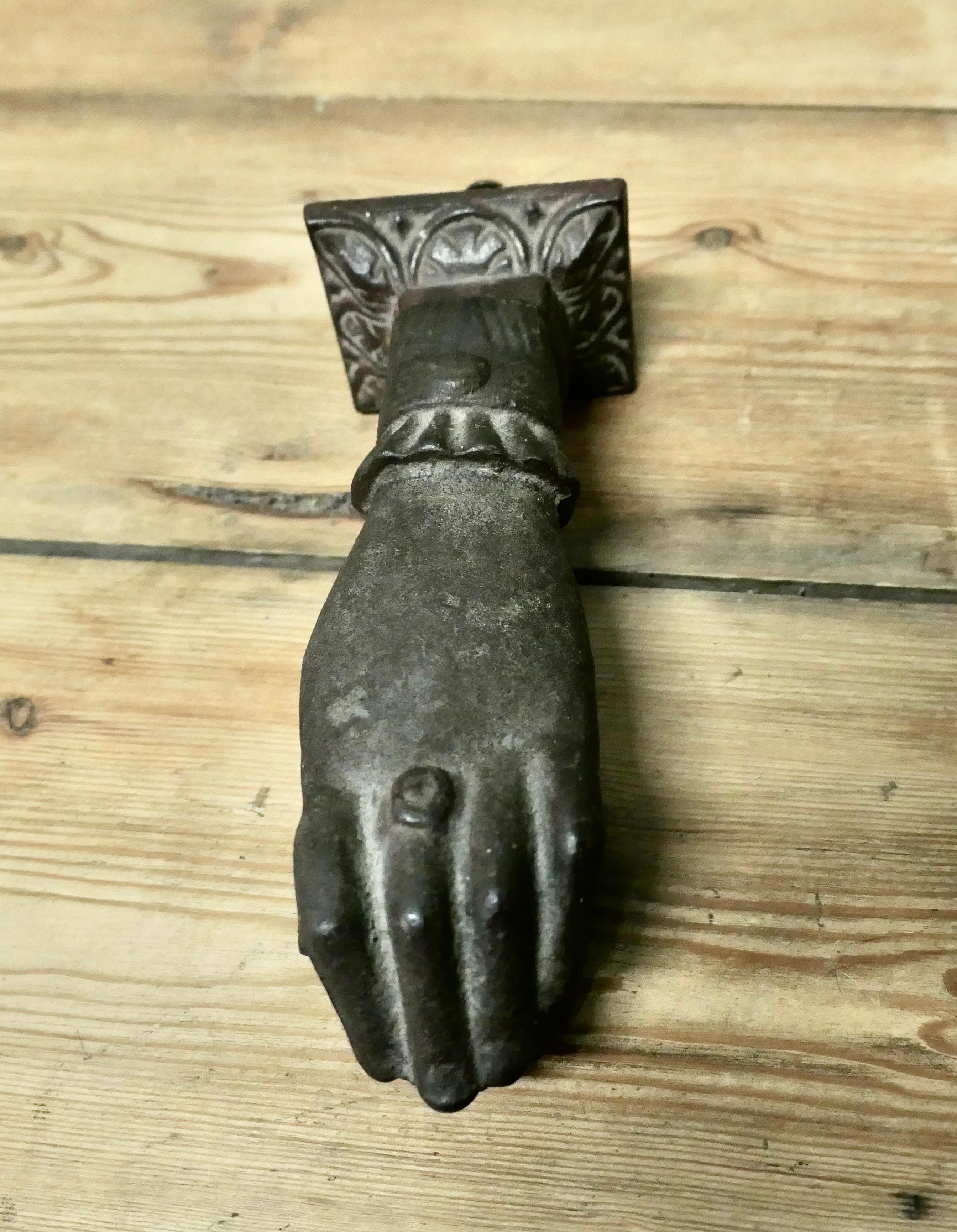 Heavy Iron Door Knocker, a Hand Knocking on the Door

This is a superb door knocker, it is very heavy indicating that it has come from a heavy oak door
The door knocker is in sound condition it measures 11” in diameter 
GY95
