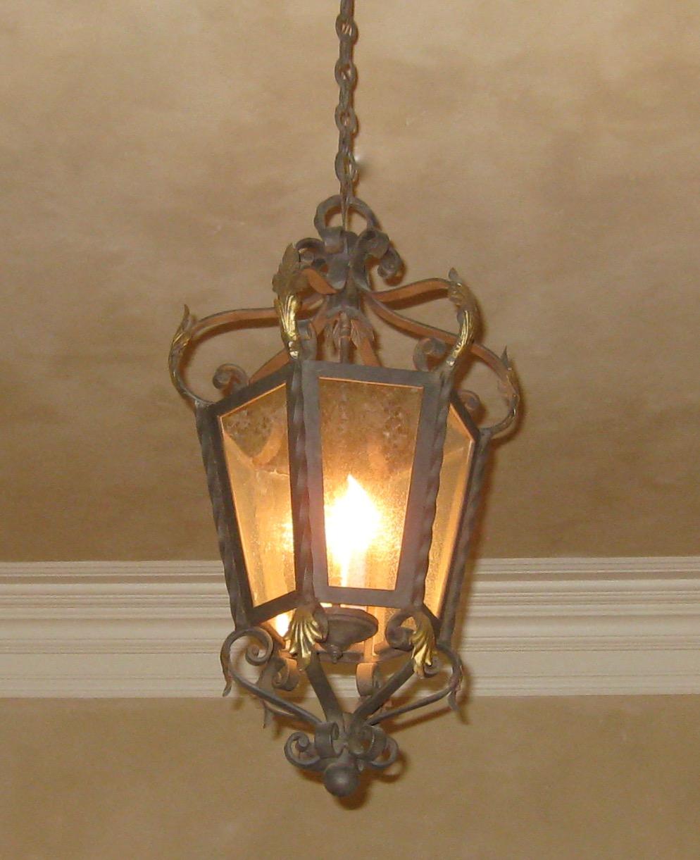 Part of the chandelier product line, this is our Italian Lantern B. This fixture can be used for interior or exterior use and is UL listed. 3' chain included. Three candelabra base bulbs up to 60 watts/socket. Also available in a lighter iron gauge