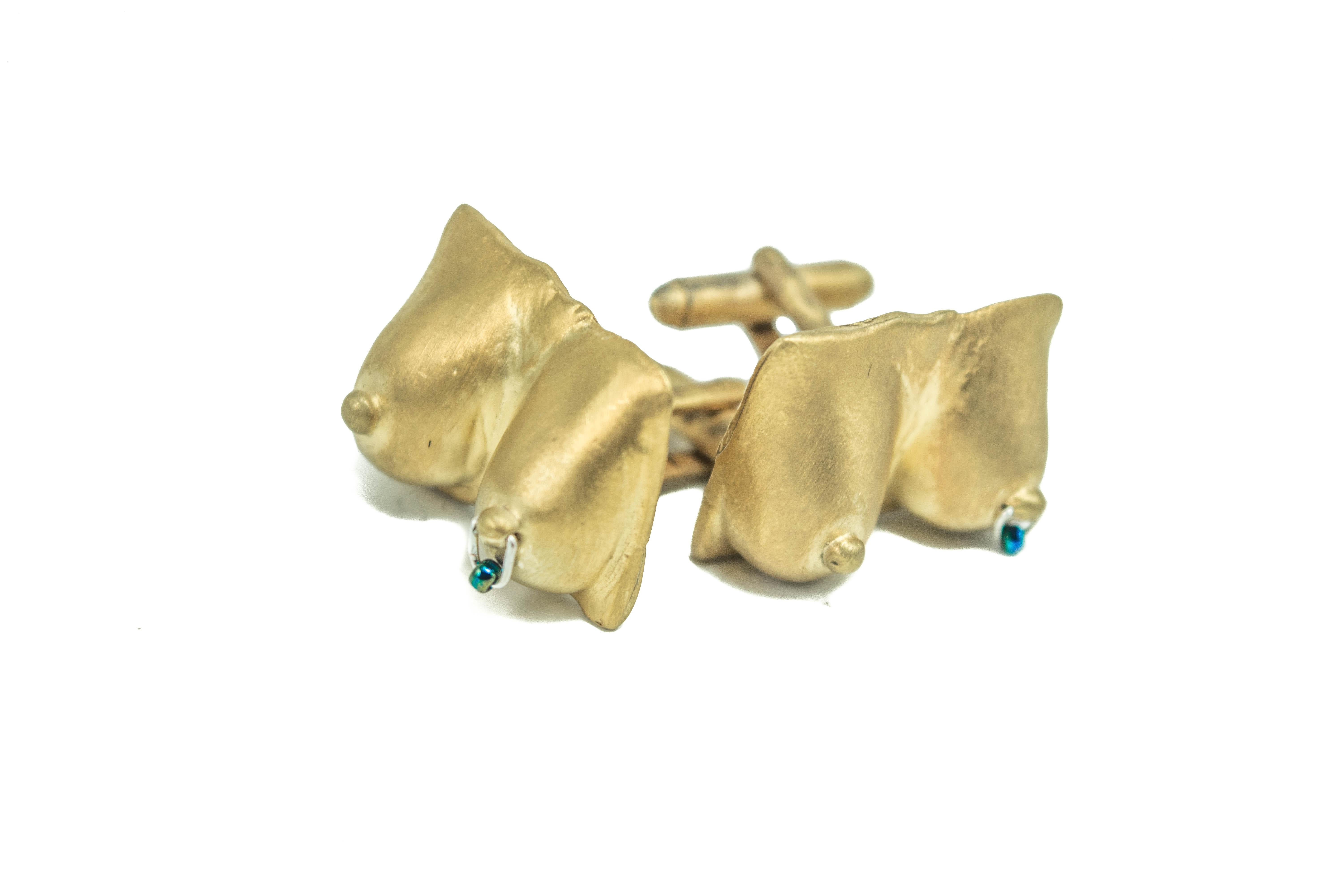 18K Gold-plated brass bust cufflinks with a pierced nipple.

Designed and created by Shanel Odum in New York-

