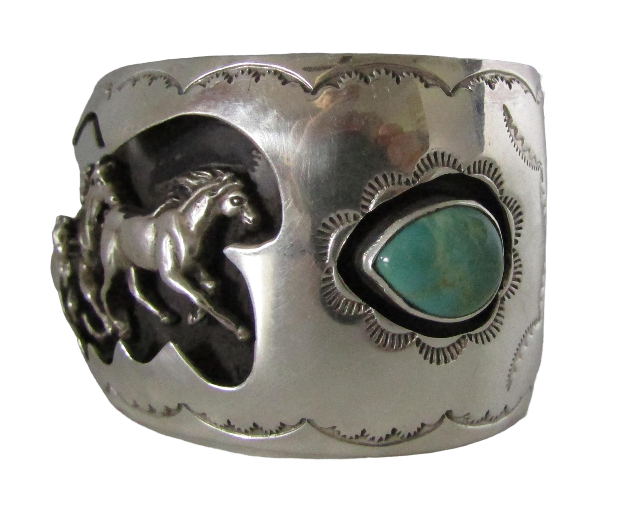 This Navajo Cuff was created by master silversmith Tim Yazzie, who draws all of designs free-hand on the silver. His running horses design evokes a sense of Strength, protection, guidance, freedom and spirit. It's impeccable. The cuff is signed T.