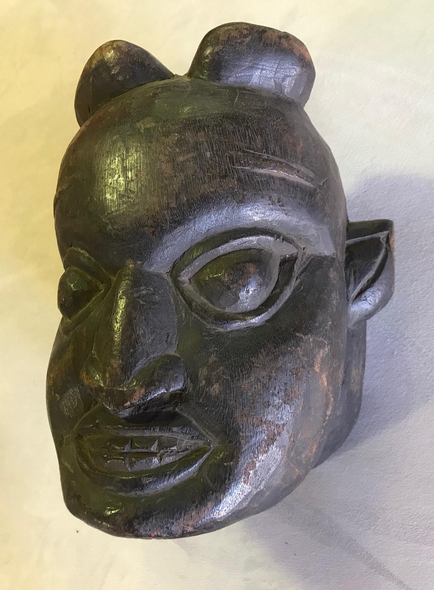A wonderfully carved, heavy tribal mask. The mask is from the collection of famed American writer Gore Vidal who was an avid collector of tribal masks and artifacts. It was listed as being from Papua New Guinea but could be from another region.
