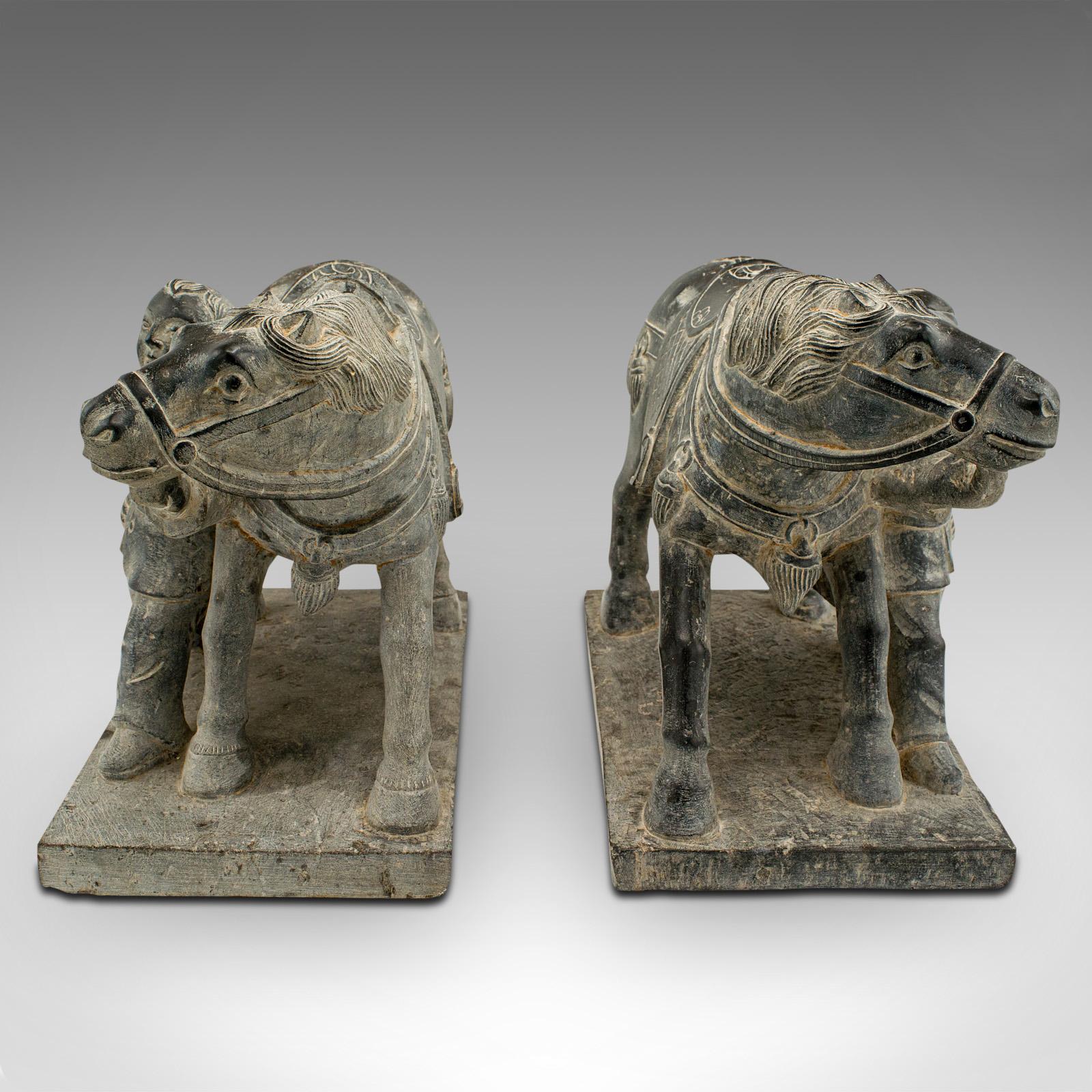 This is a heavy pair of vintage horse and groom figures. An Oriental, stone fireside ornament or bookends, dating to the late 20th century, circa 1980.

Charming figures of substantial proportion and mass, perfect as bookends
Displaying a desirable