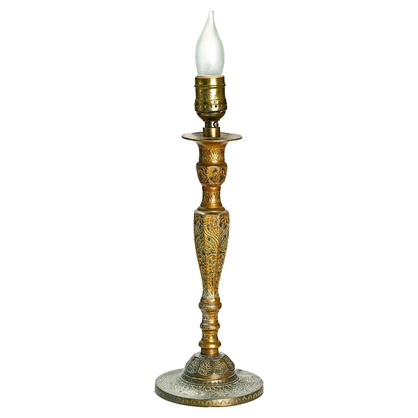 Very heavy & solid Boho style engraved candlestick converted into a lamp. Wired with inline roller switch on a long cord. 
RH silk clip on shade is included.
Very heavy & solid candlestick converted into lamps. 
No makers mark.