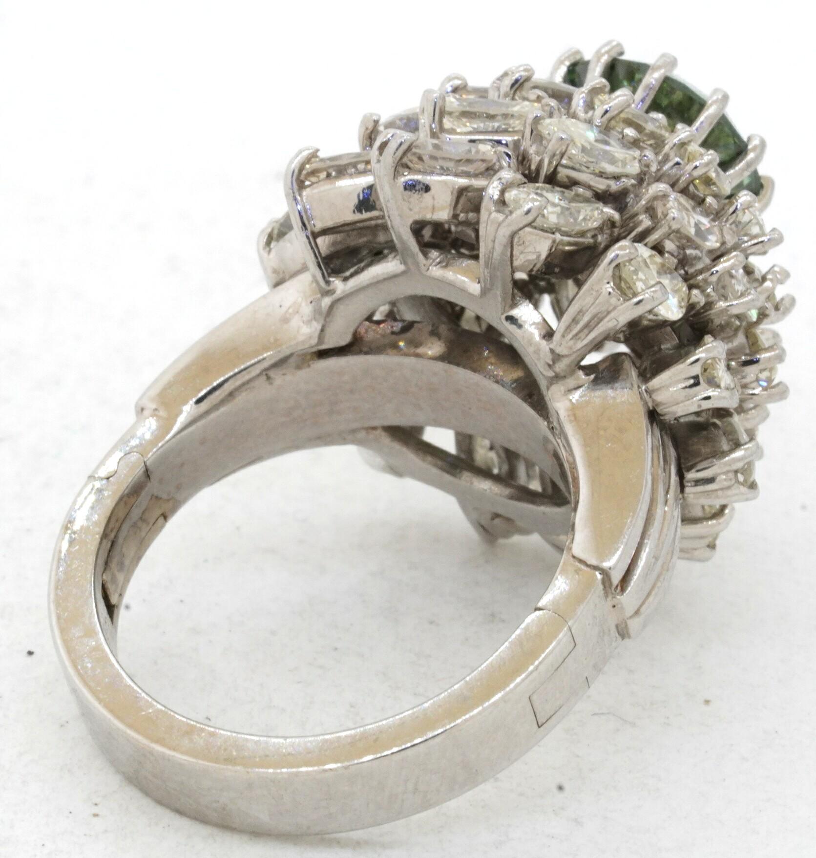 Heavy Platinum 7.76CT VS Fancy Green diamond cluster Ballerina ring size 7. This extraordinary piece of jewelry is crafted in gorgeous Platinum and features 37 diamonds with a combined weight of approx. 7.76CT. This includes an approx. 2.60CT center