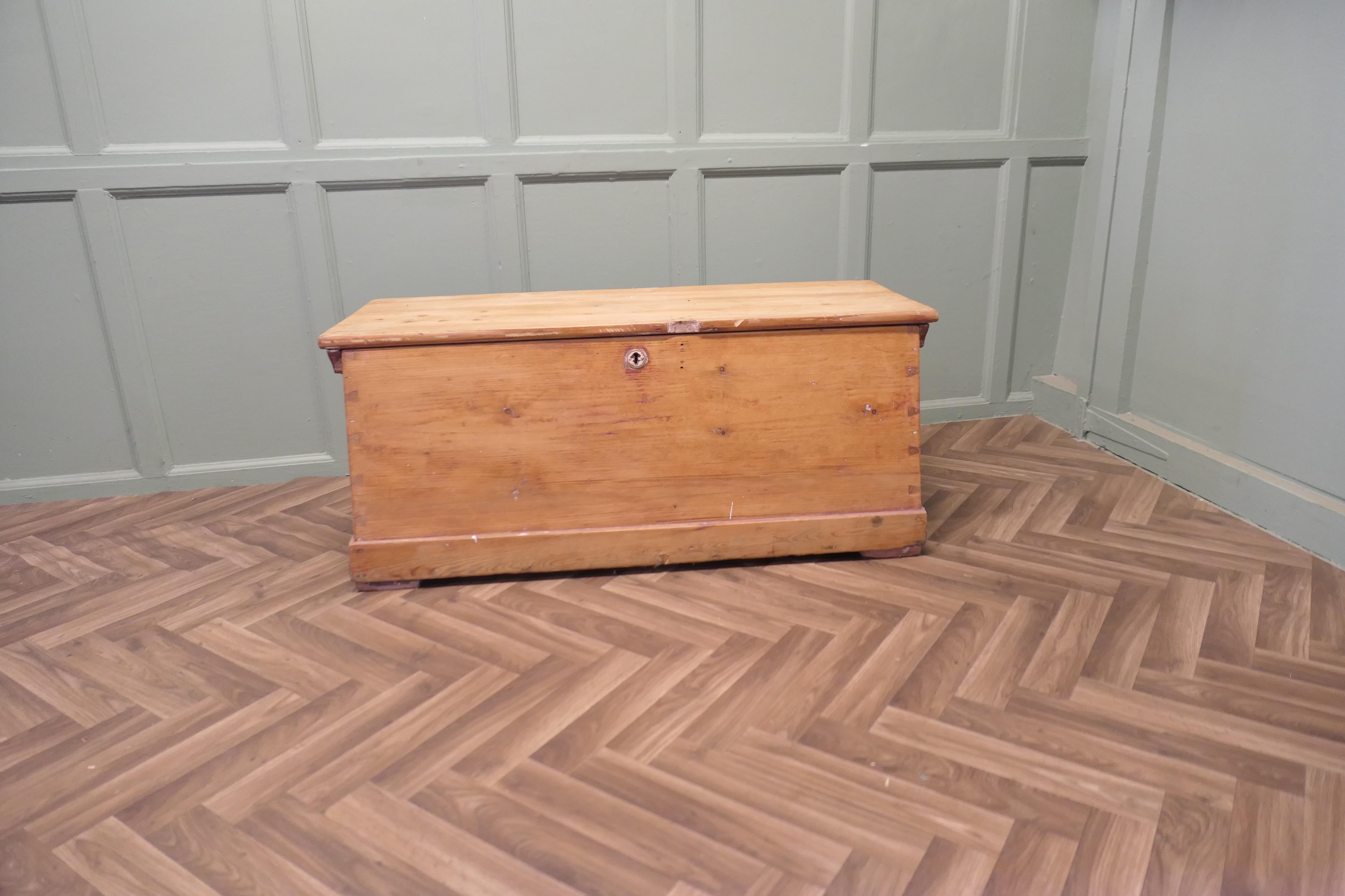 Heavy Quality Pine Carriage Trunk
 
This interesting piece is very heavy quality and was made to be used as a carrier for a cart, this can be seen in the unusual shape which is slightly larger at the bottom for stability
The box has a carrying