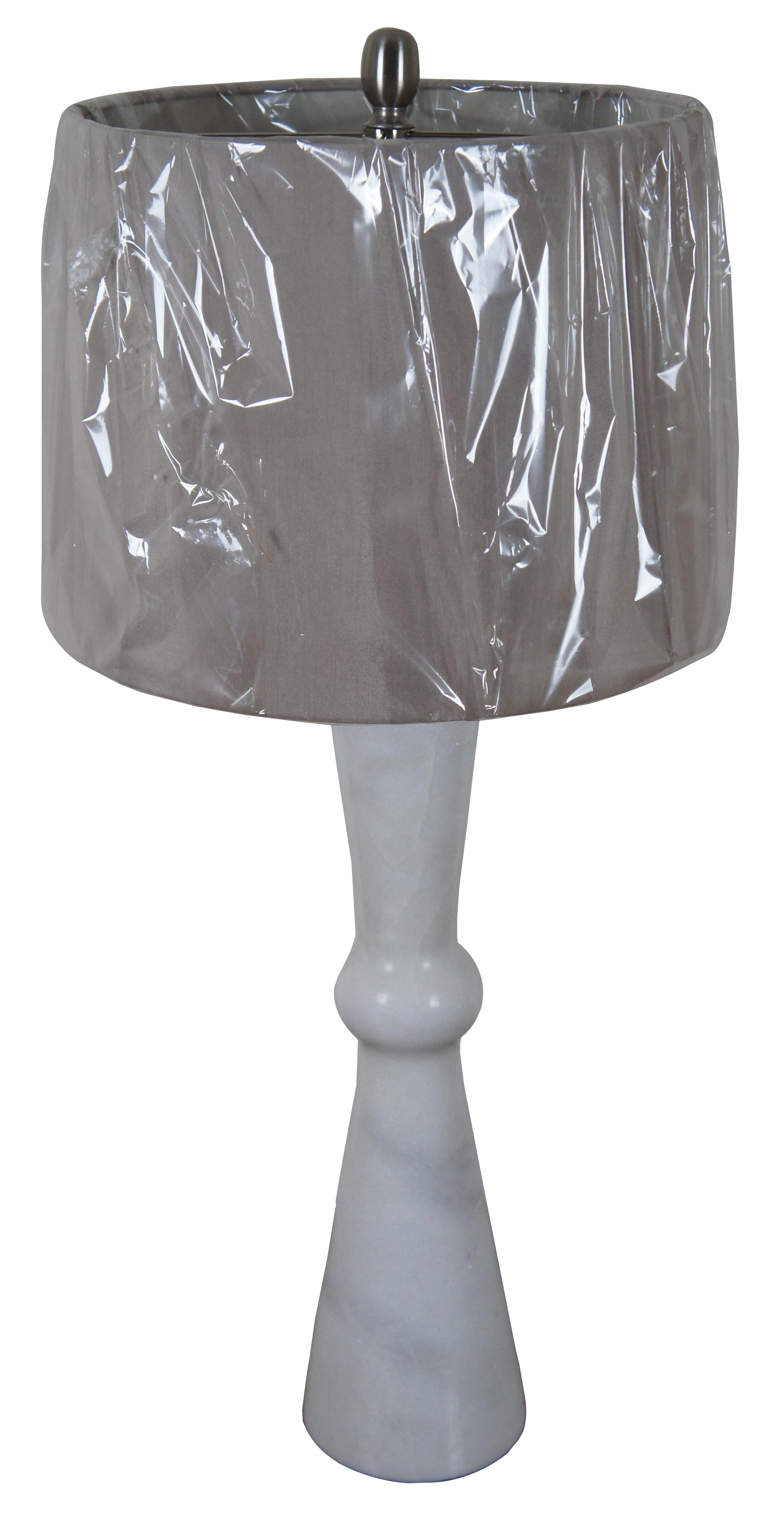 Elegant white marble table lamp featuring an hourglass / bowtie or scroll shaped column or pillar with the ends tapering to a rounded center; includes a taupe drum shade. Very Heavy. TL31568TJX

Measures: 5.75” x 26” / Shade - 15” x 11” / Total