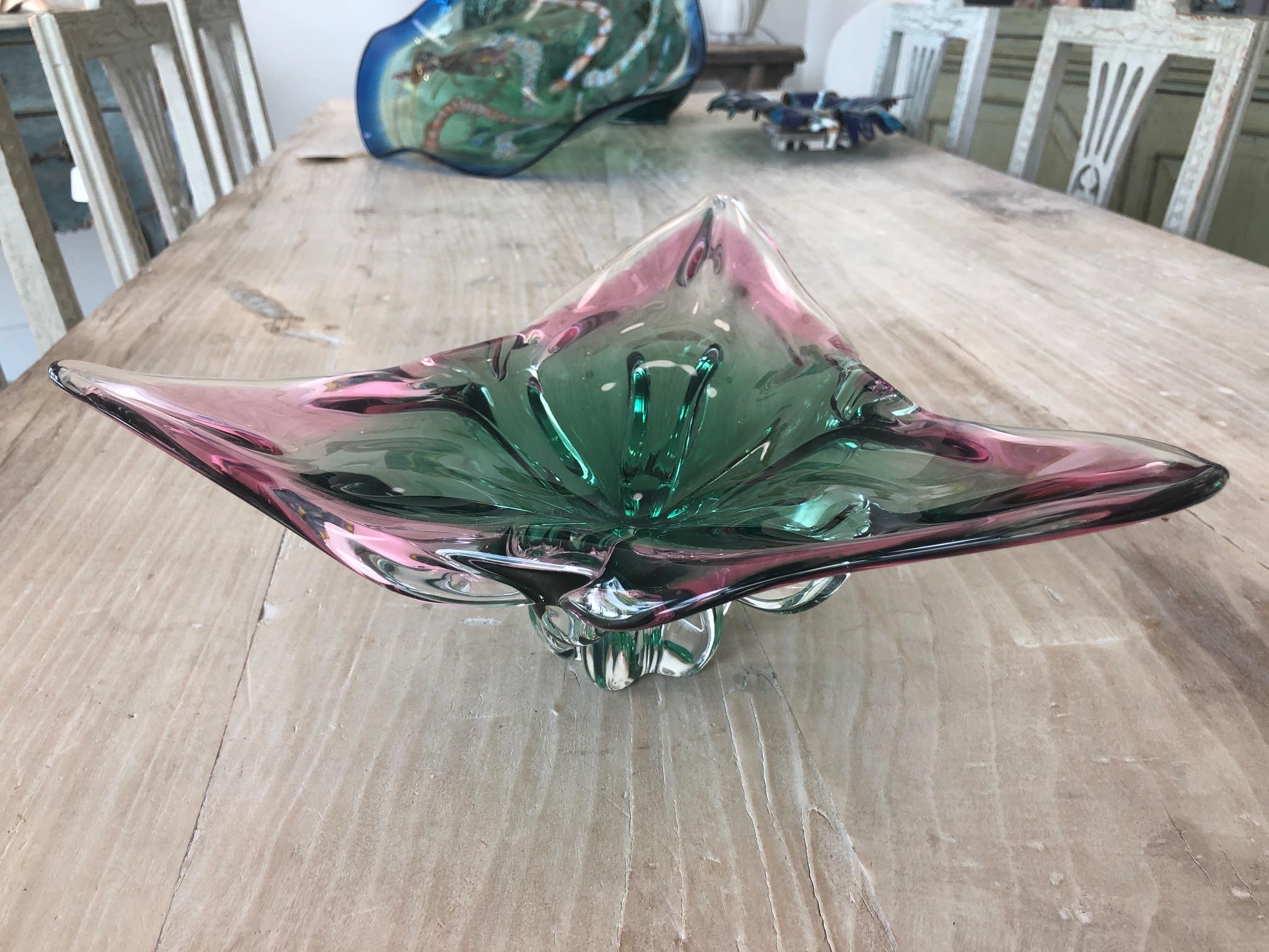 Heavy signed Murano glass bowl. Triangle-shaped with vibrant pastel green and pink hues throughout, circa 1960s.

The bowl measures (inches):
13