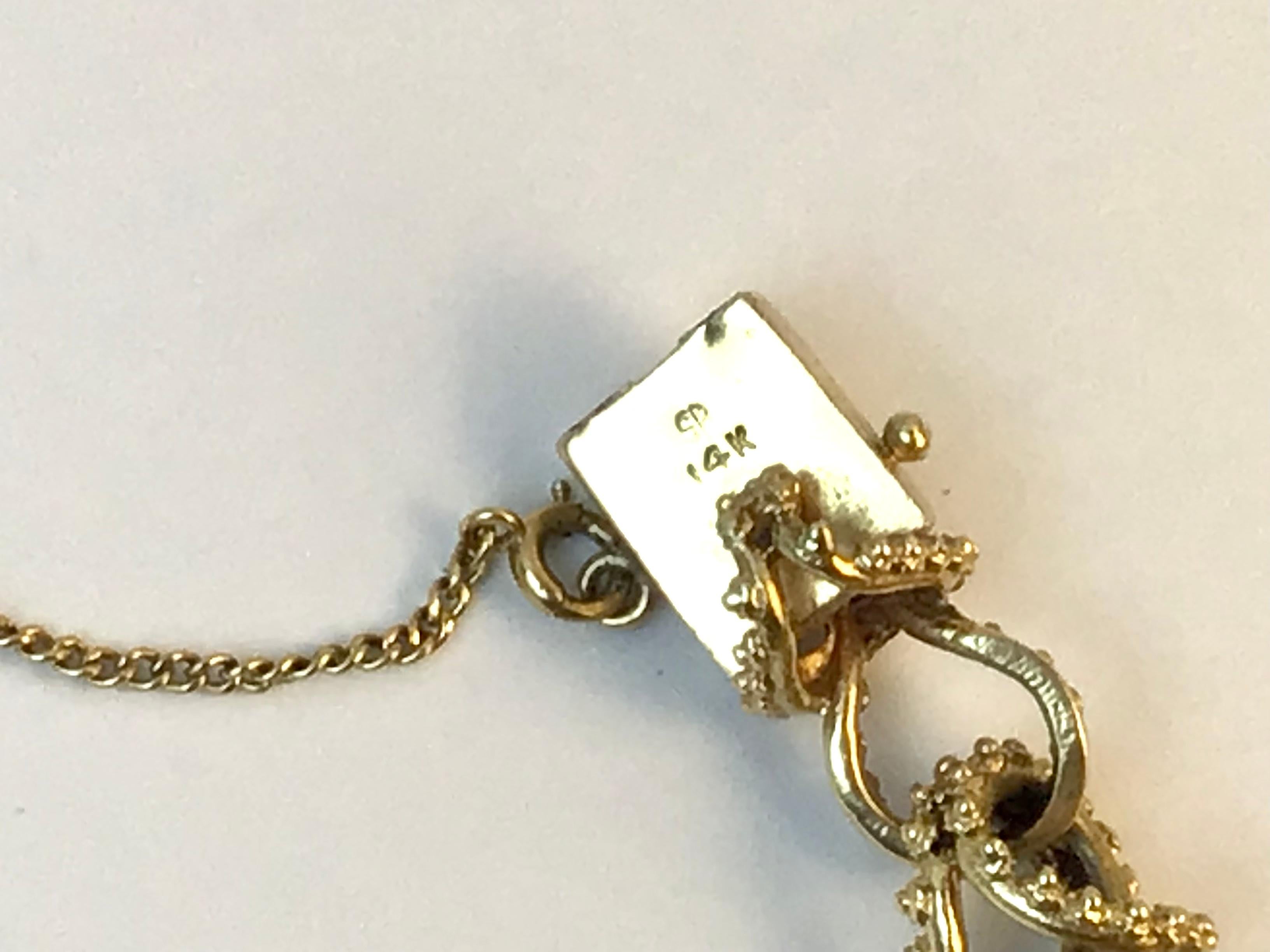 Armband aus massivem 14-karätigem Gold mit Charms im Zustand „Gut“ im Angebot in Bradenton, FL