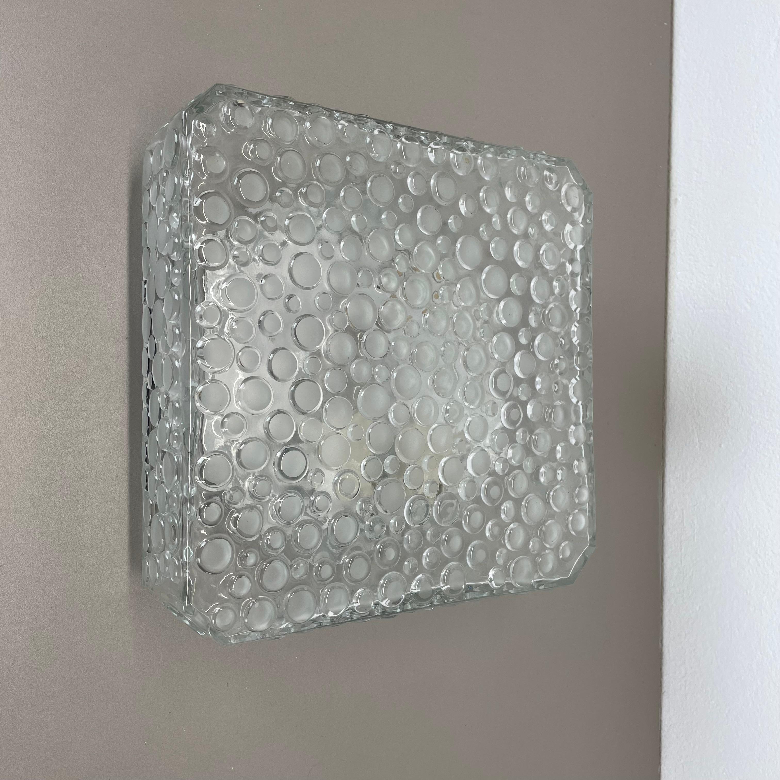 Article:

Wall light or ceiling light


Producer:

Hustadt Lights, Germany.



Origin:

Germany.



Age:

1970s.



Description:

Original 1970s modernist German wall light, ceiling light made of heavy structured bubble glass with a solid meta wall