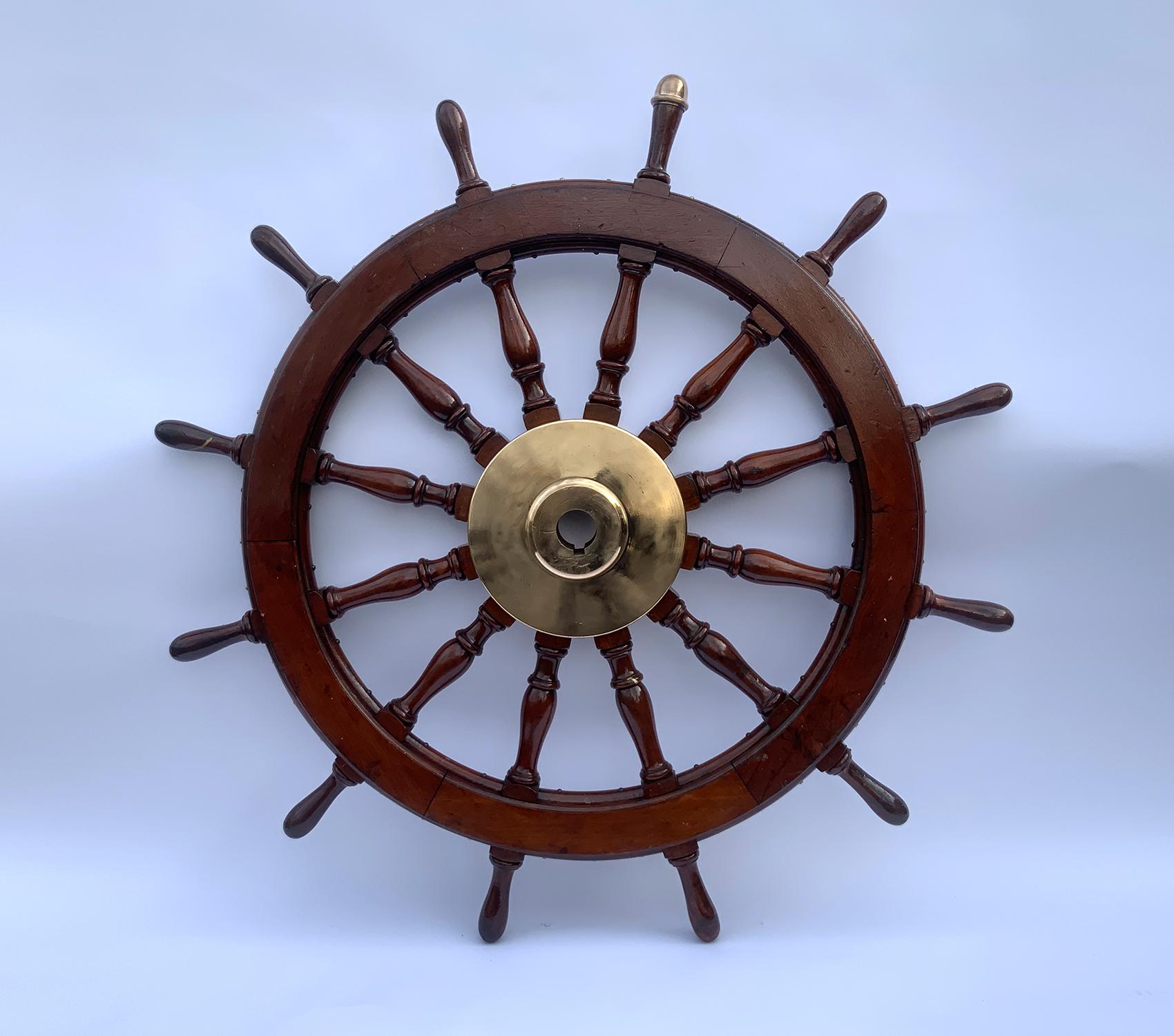 Antique five-foot ships wheel built to an exceptional standard of girth and strength. Massive brass hub with wide keyhole. Varnish finish on the hardwood wheel. Circa 1870. As heavy and impressive as they get.

Weight: 158 LBS
Overall Dimensions: