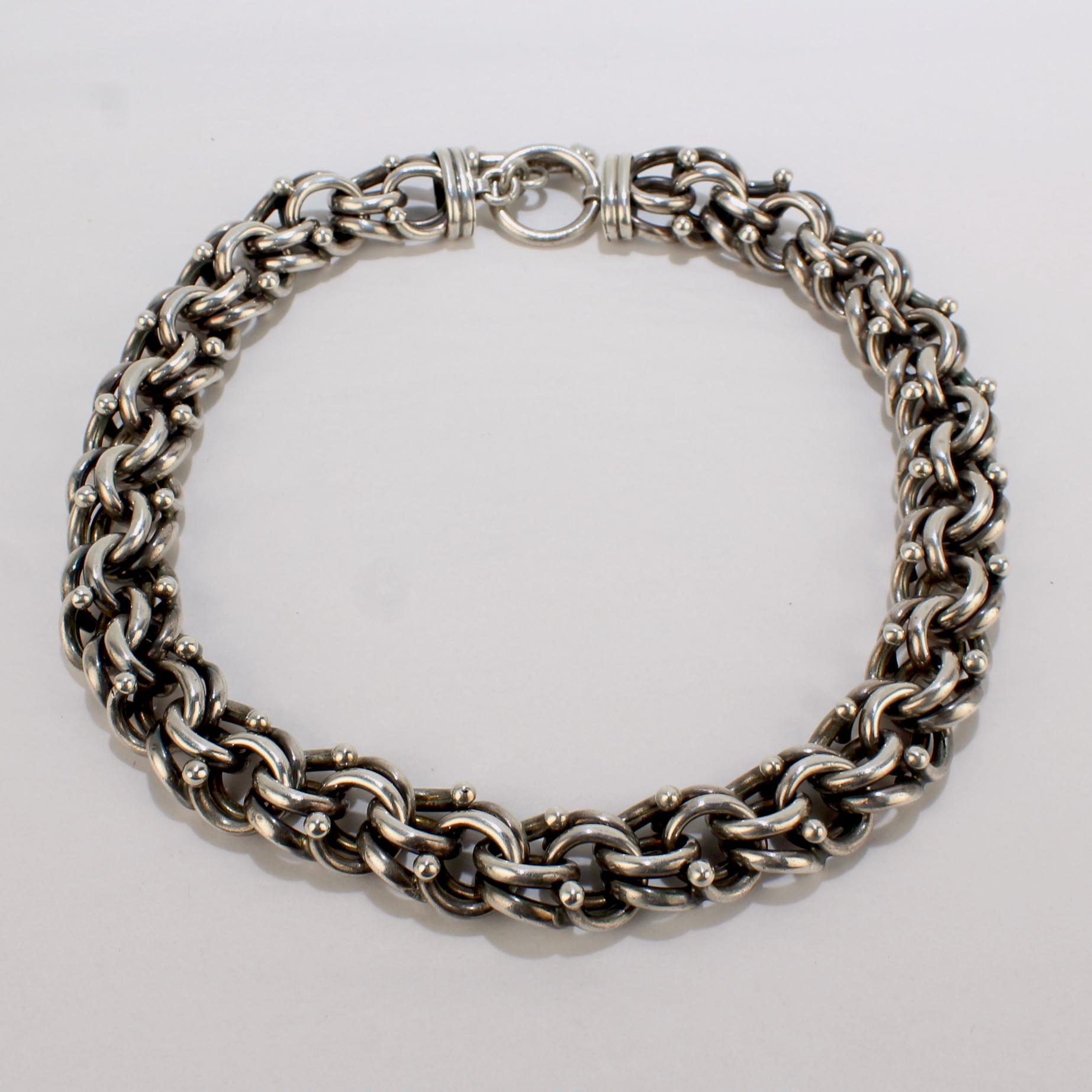 A very fine heavy gauge Mexican sterling silver dog chain style choker.

With large, twisted sterling silver links and a large toggle clasp!

A great, stylish necklace!

Date:
20th Century

Overall Condition:
It is in overall good, as-pictured, used