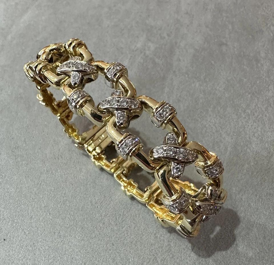 Vintage X Bracelet with Diamond Links in 18k Yellow Gold

Link Diamond Bracelet features Square Open Links with X-shaped connectors and Diamonds on middle sections with natural Round Brilliant Diamonds, all set in 18k Yellow Gold. The bracelet is