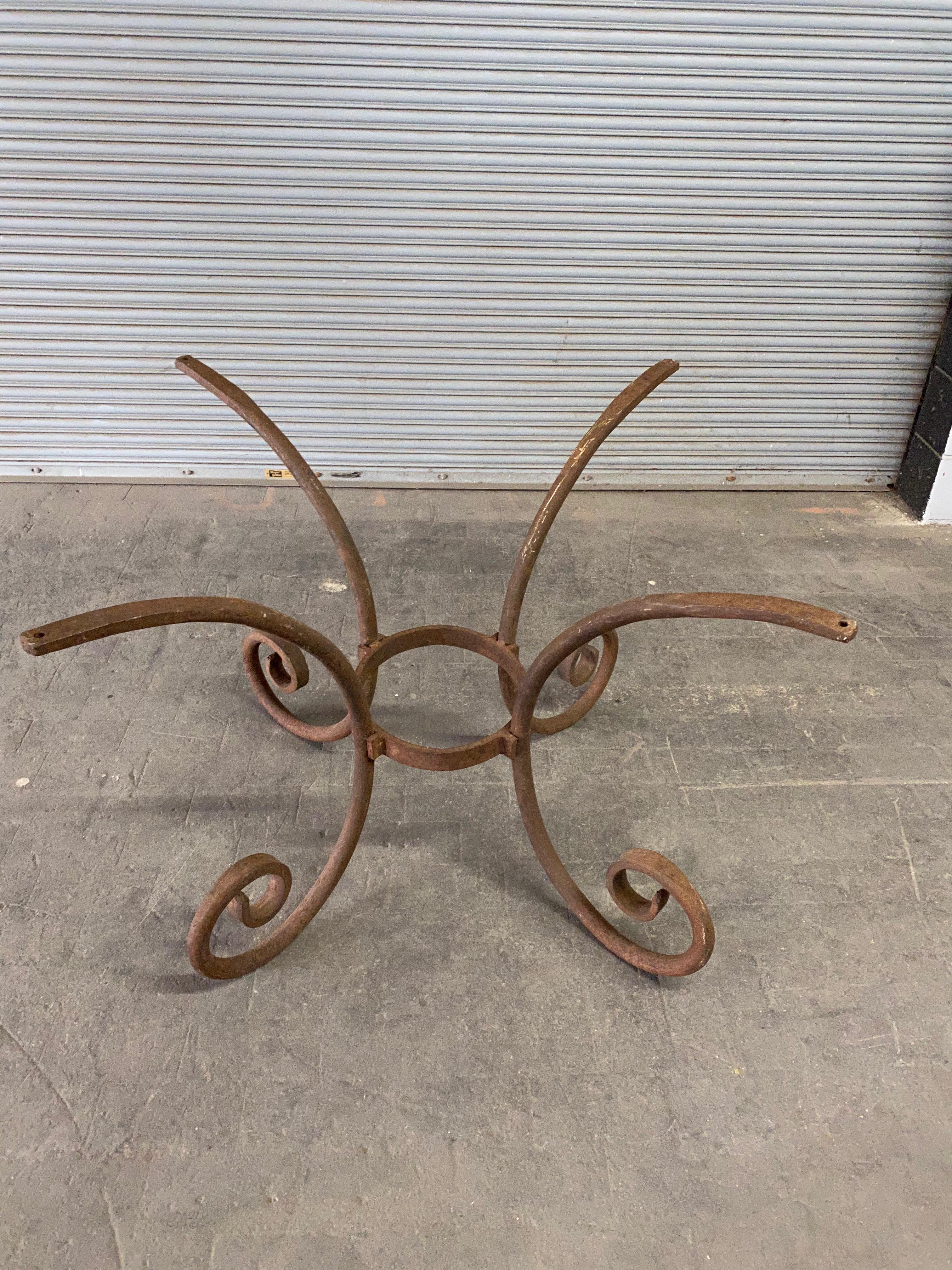 French wrought iron oval table base, contemporary design. This table base is very well made and heavy. It is suitable for a large stone top. The table base has a rusted finished but can reality be prepped for paint.

 