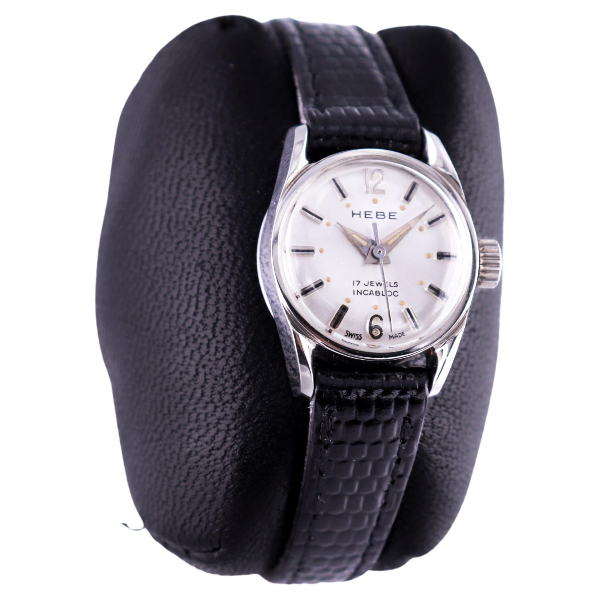 FACTORY / HOUSE: Hebe Watch Company 
STYLE / REFERENCE: Classic Round 
METAL / MATERIAL: Stainless Steel
CIRCA / YEAR: 1960's
DIMENSIONS / SIZE: 25 Length X 20 Diameter
MOVEMENT / CALIBER:  Manual Winding / 17Jewels 
DIAL / HANDS:  Silvered with