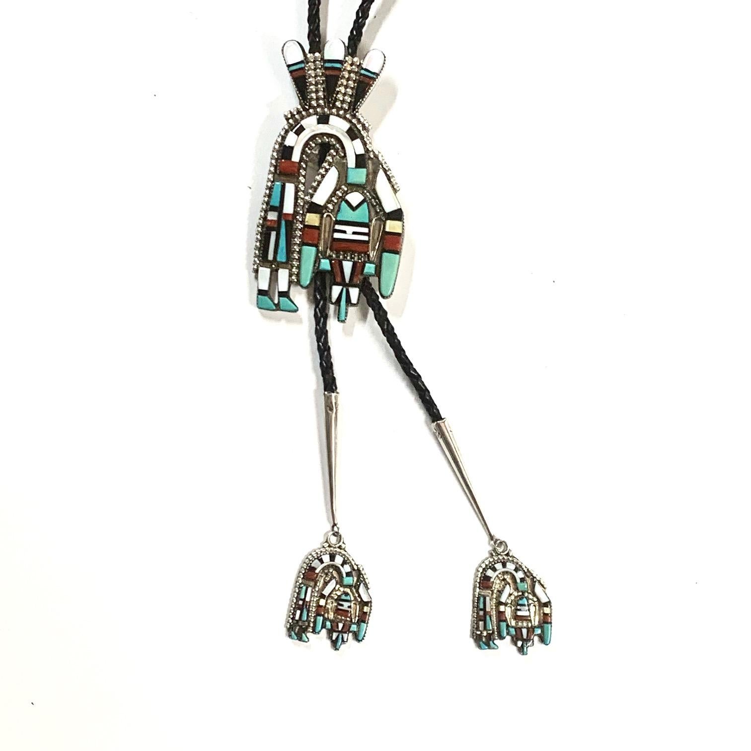 Hecili Icion Navajo Sterling Coral Turquoise Onyx Bolo Estate CCBOLO18

New Vintage Navajo Bolo adorned with Mother Pearl, Coral, Onyx, Turquoise stones handcrafted by the reknowned artist Heceli Icion

•Measurements: 46 inches

•Weight: 85