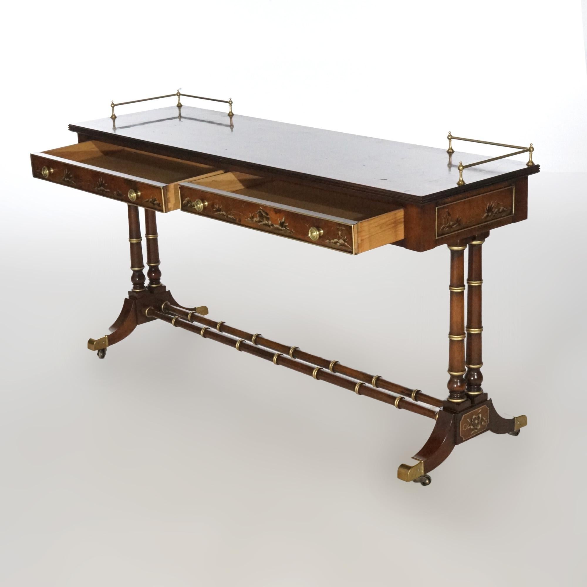 A console table by Heckman in style 75245 offers mahogany and burl construction with gilt decorated top having brass gallery over double drawer case with chinoiserie decoration, raised on faux bamboo trestle base with gilt highlights, maker mark in