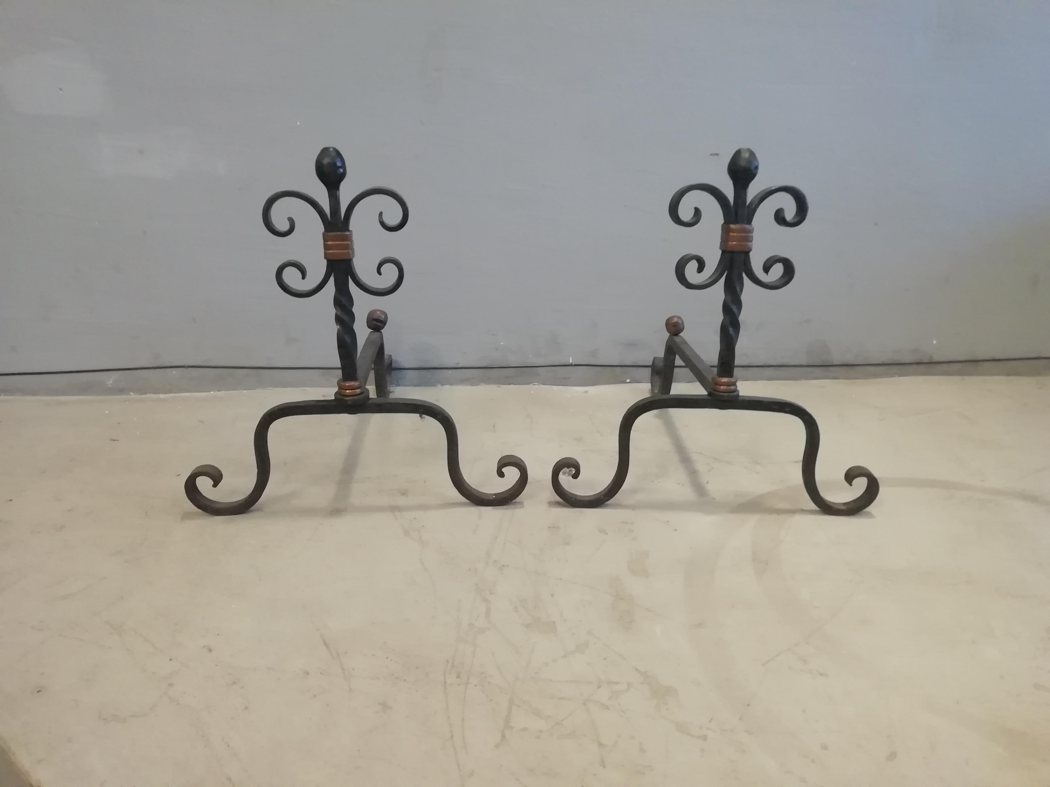 Rare Mexican Mid-Century Modern set of iron fireplace tools by Mexican designer and metalworker Héctor Aguilar. The set is composed of 5 pieces: a pair of andirons, a poker, a shovel and a pair of tongs.

The andirons show rolled design on the top