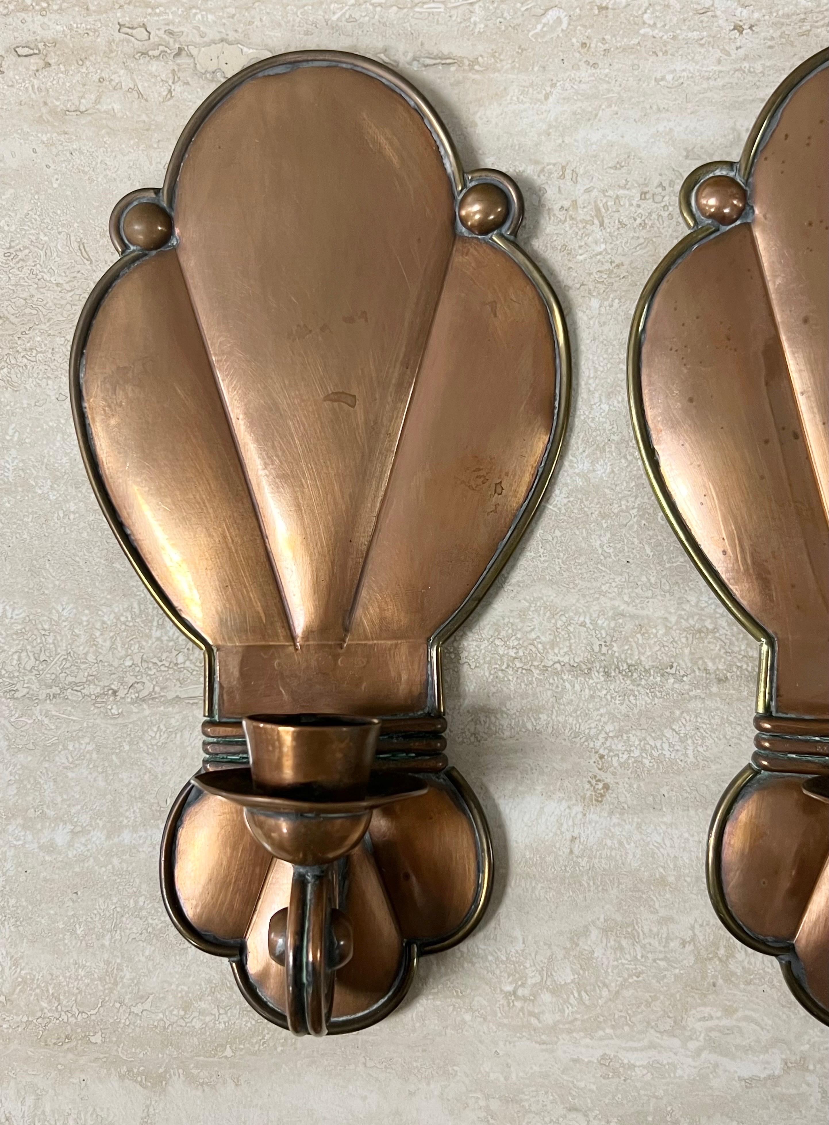 A pair of handcrafted copper sconces by Mexican master Hector Aguilar. Elegant simplicity.